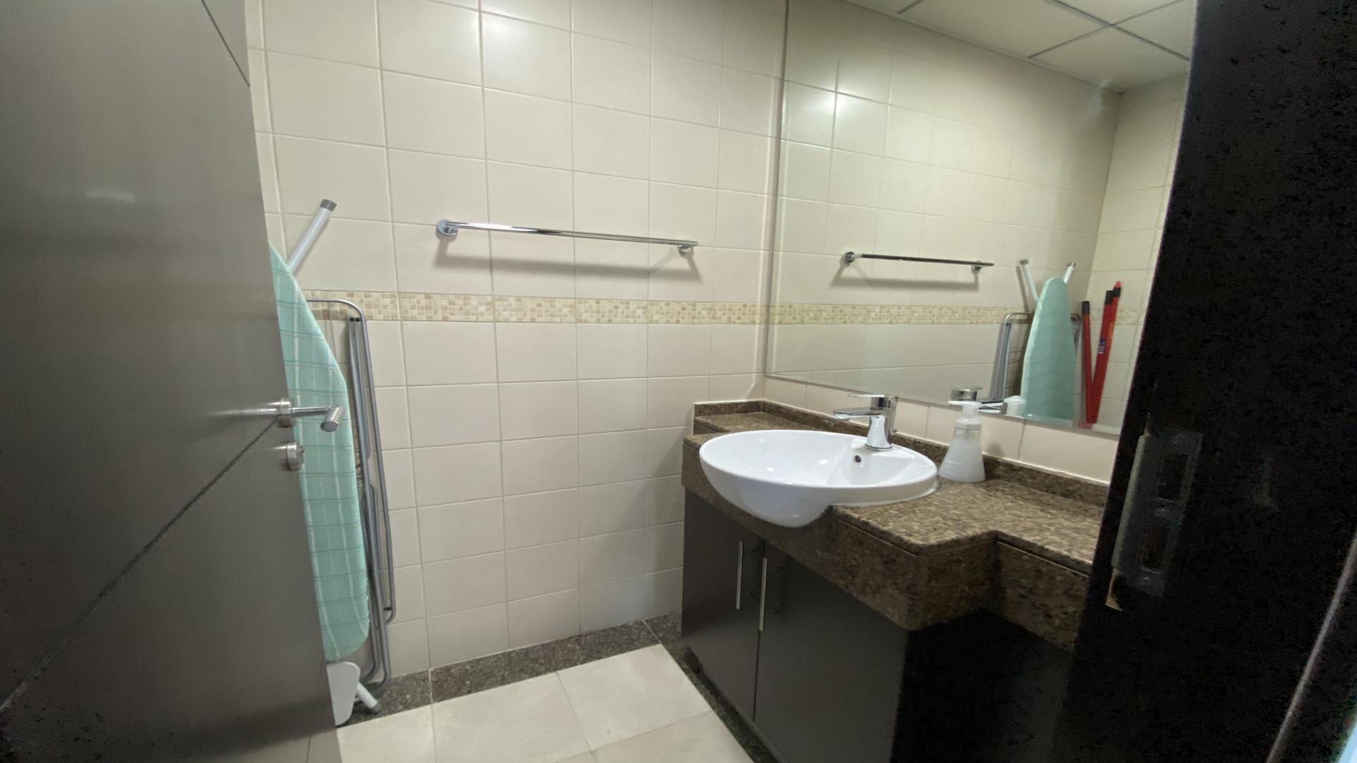 One-bedroom apartment interior with modern decor and marina views in Dubai Marina