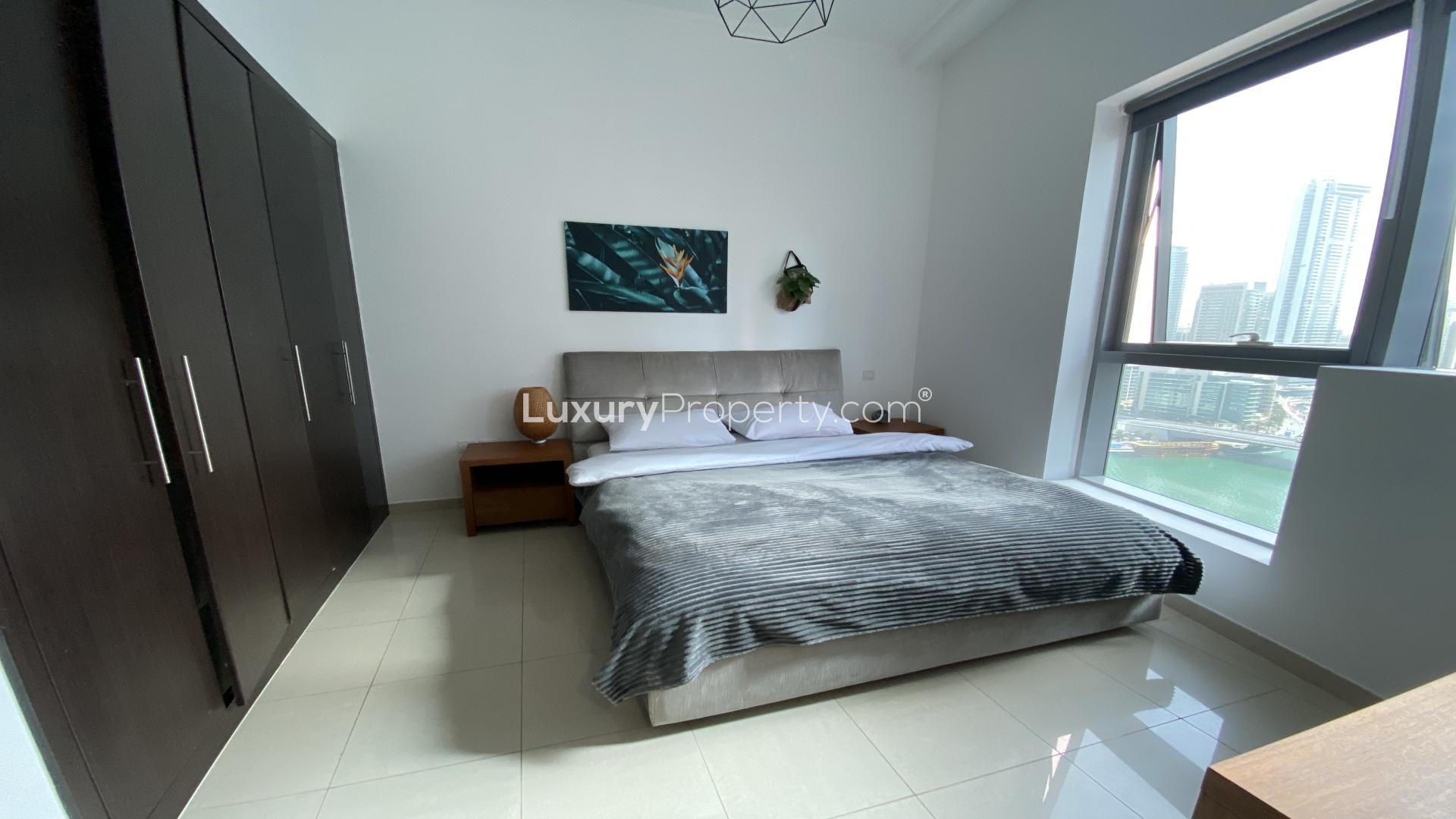Modern kitchen and living area in Dubai Marina one-bedroom apartment for sale, Bay Central