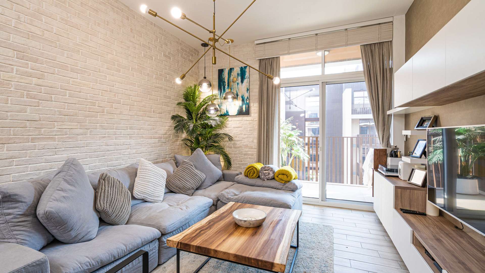 Modern kitchen and living area in Belgravia III apartment, JVC, with sleek design elements