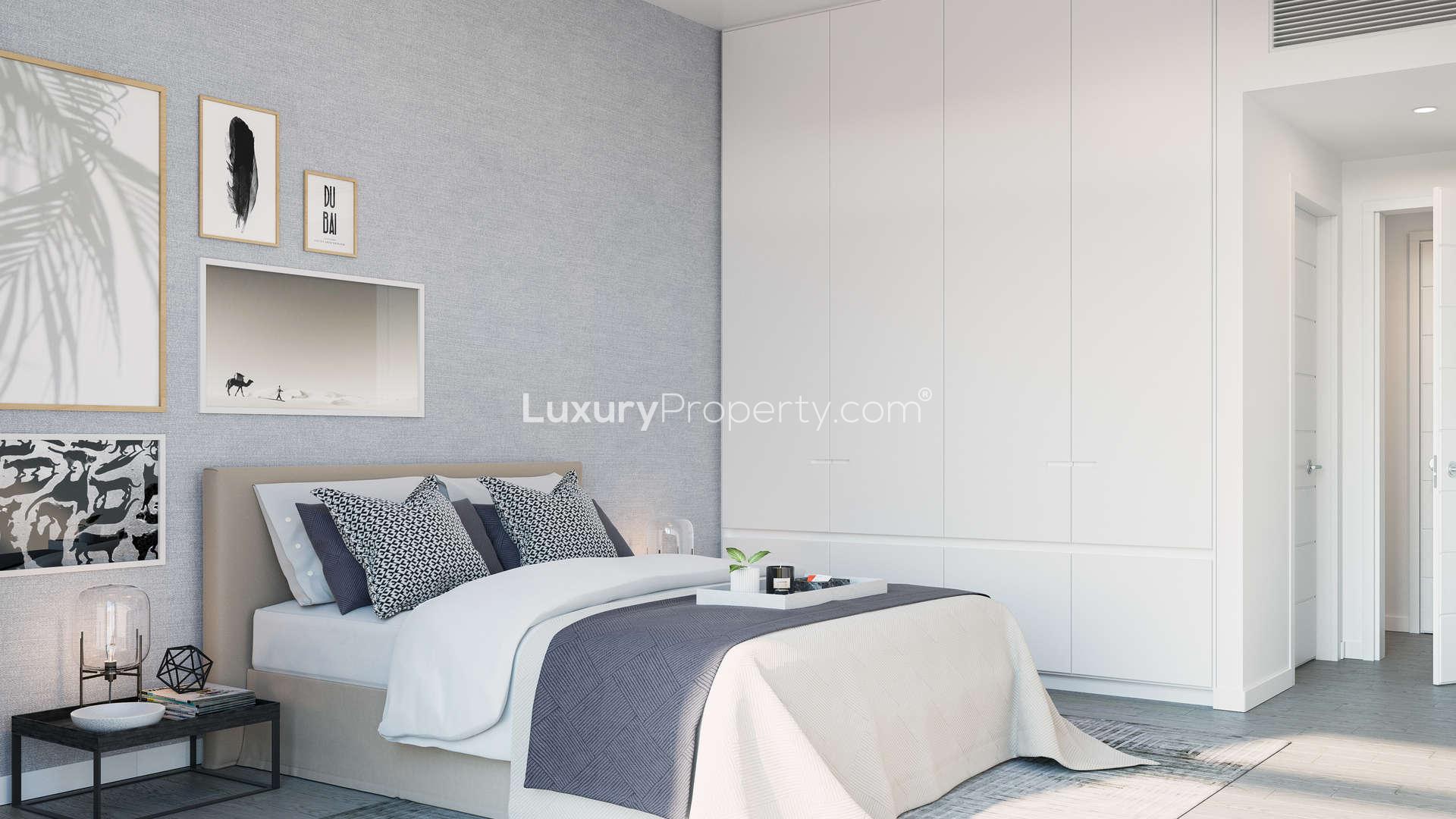 Contemporary open-plan living area in 1-bed apartment, Belgravia Square, Jumeirah Village Circle, Dubai