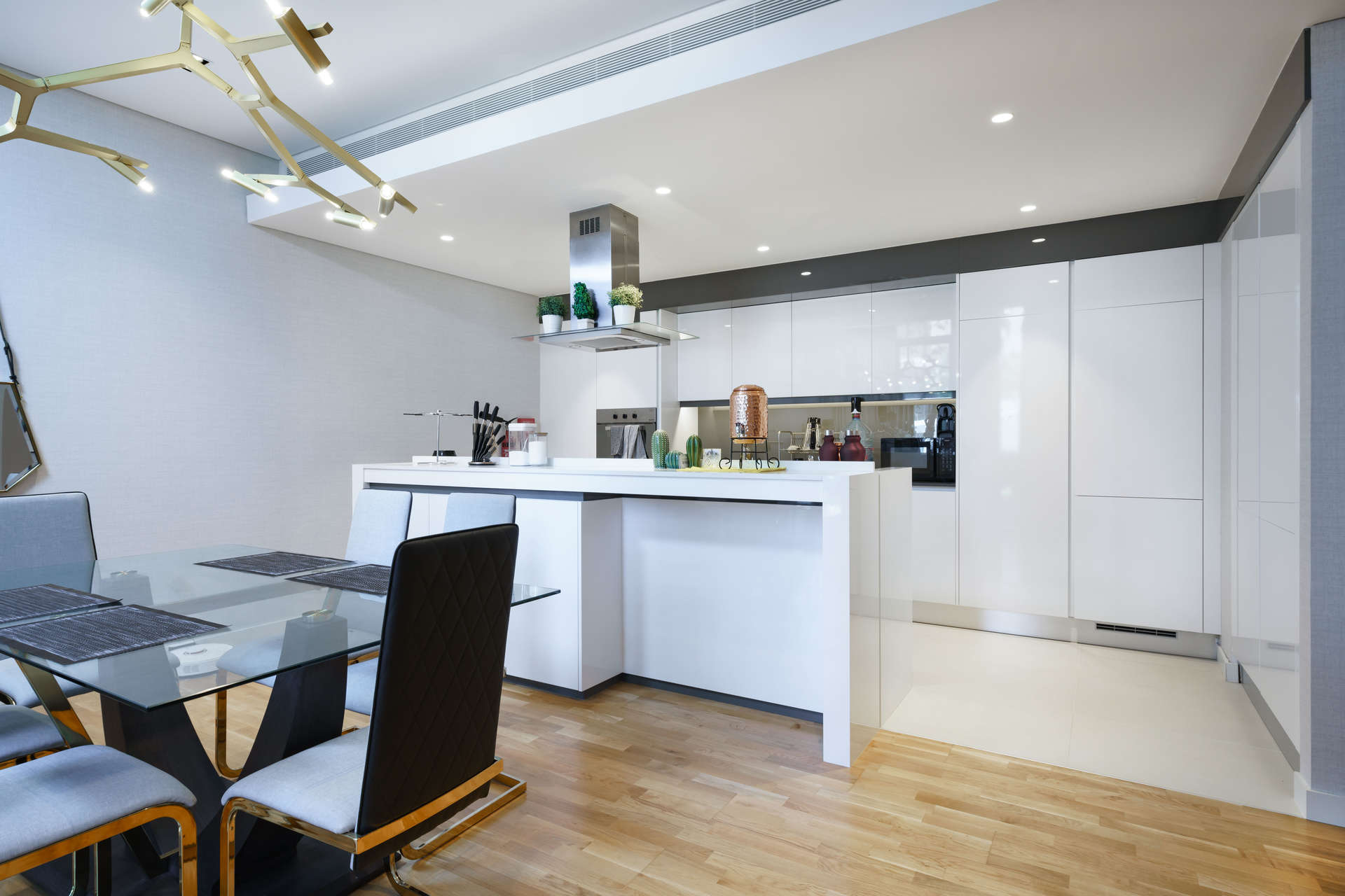 Modern dining area in 1-bedroom apartment, Bluewaters Island, elegant decor, glass table, stylish chairs