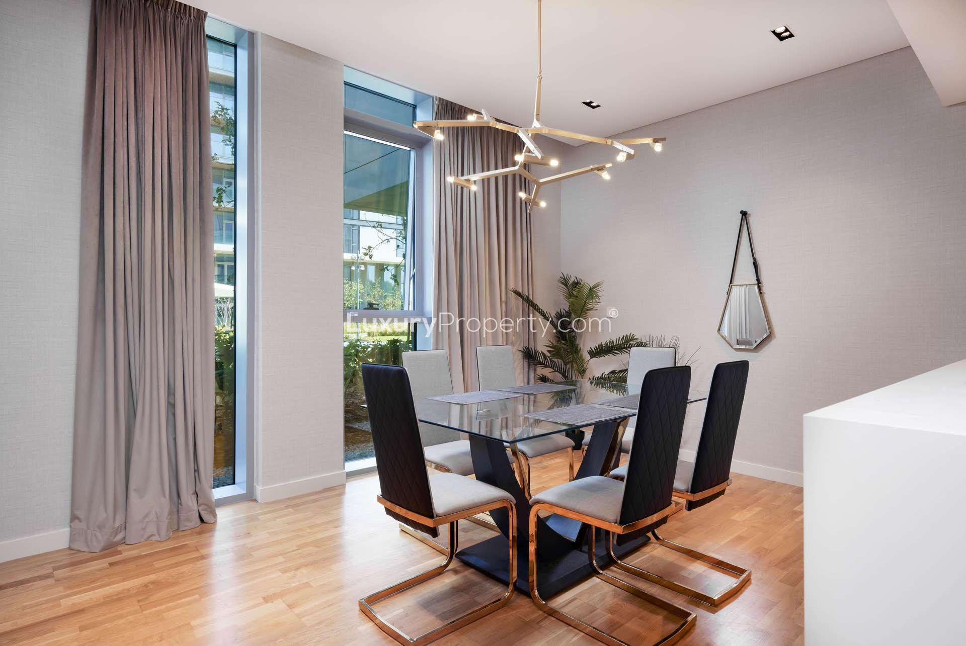 Modern living room in 1-bedroom apartment on Bluewaters Island, stylish decor and open layout