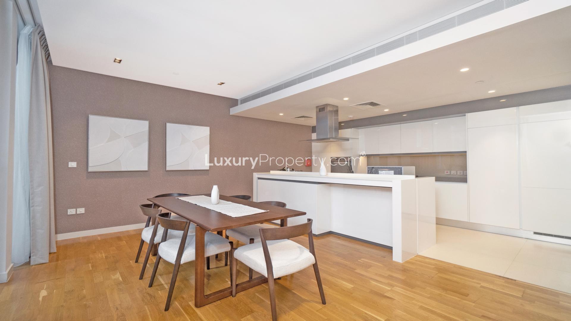 Spacious living area in 1-bedroom Bluewaters Residences apartment with modern decor and natural light