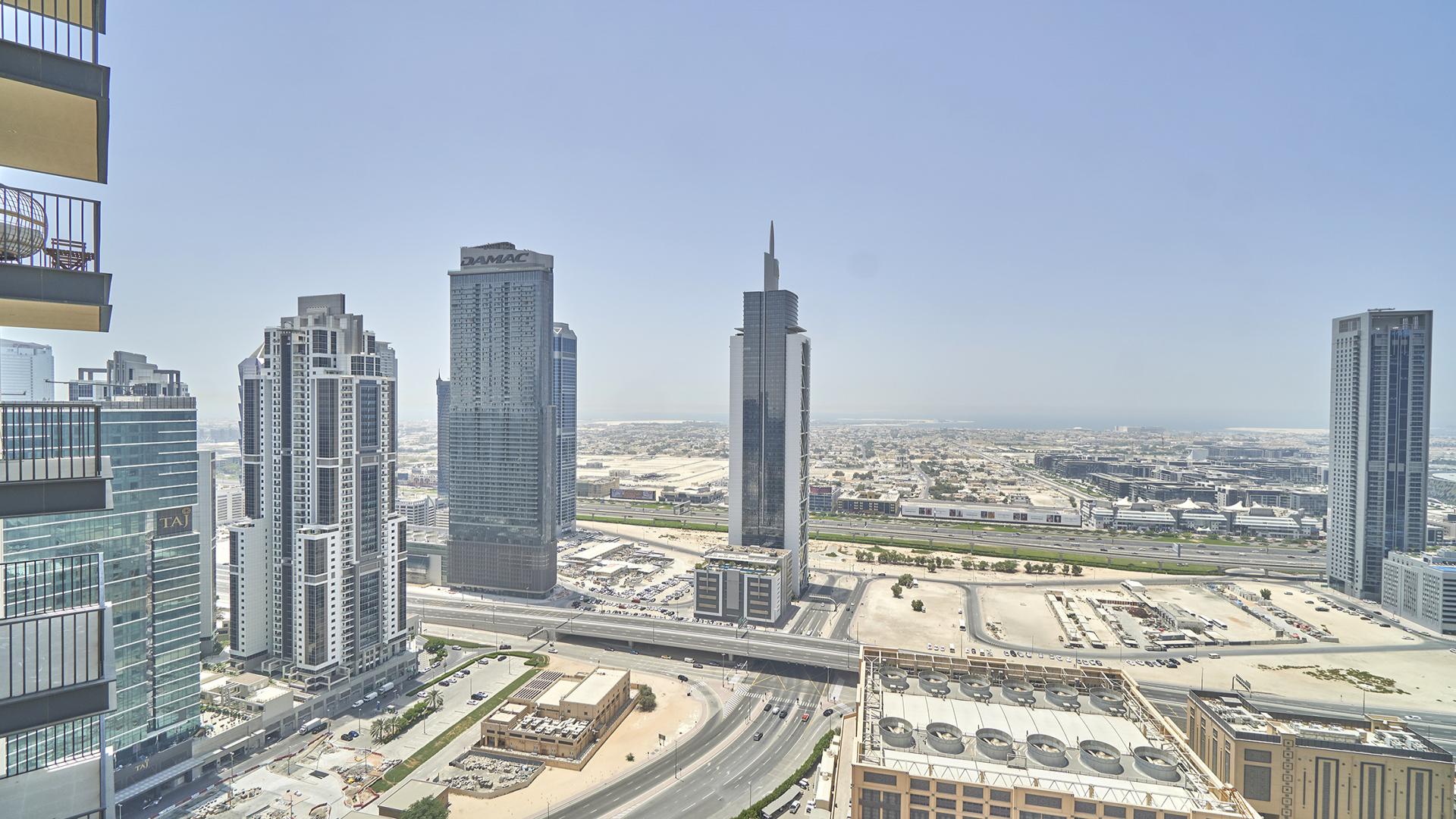 Modern one-bedroom apartment interior with large windows, BLVD Heights, Downtown Dubai