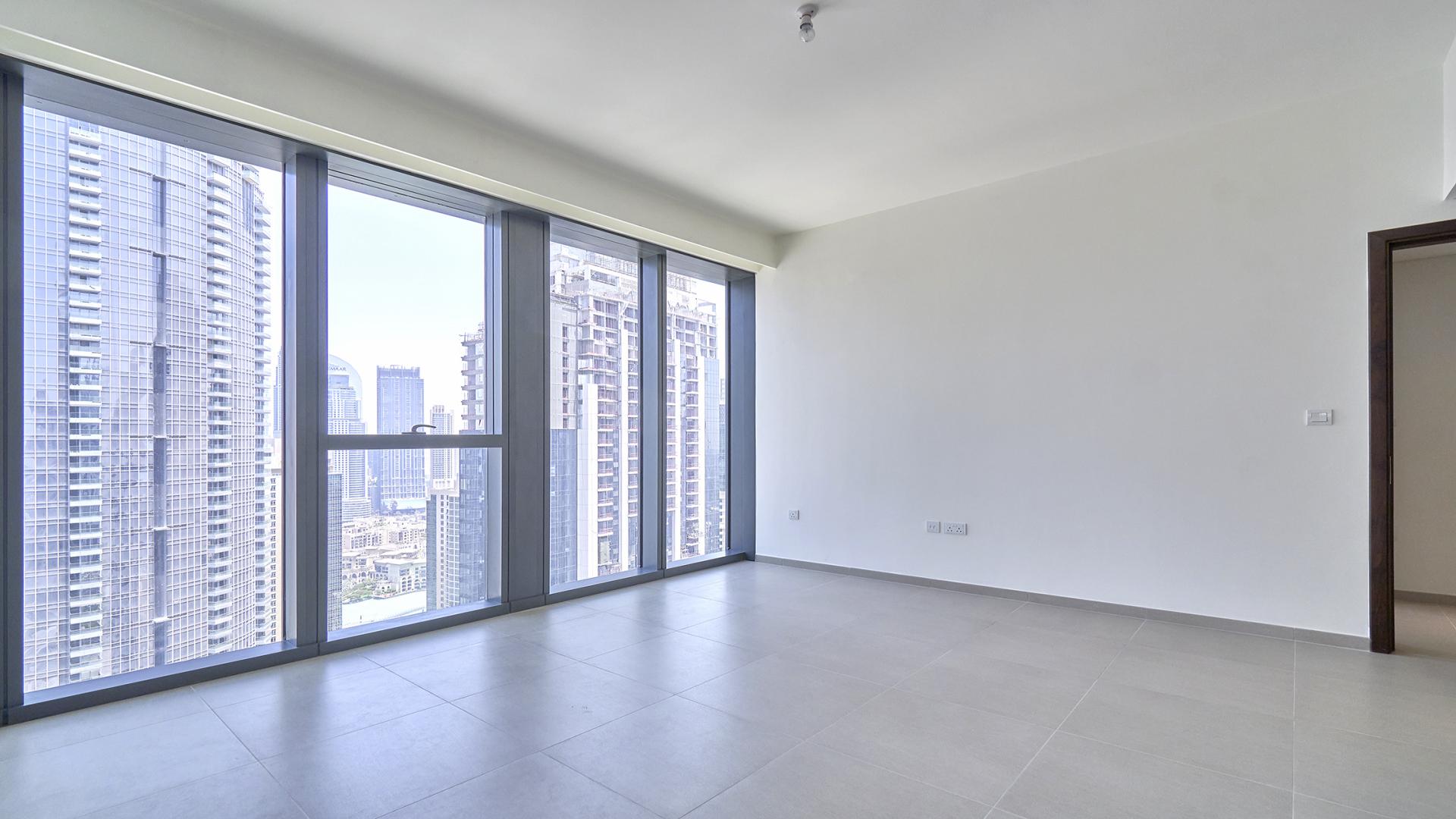 Empty apartment with large windows and city view in BLVD Heights, Downtown Dubai