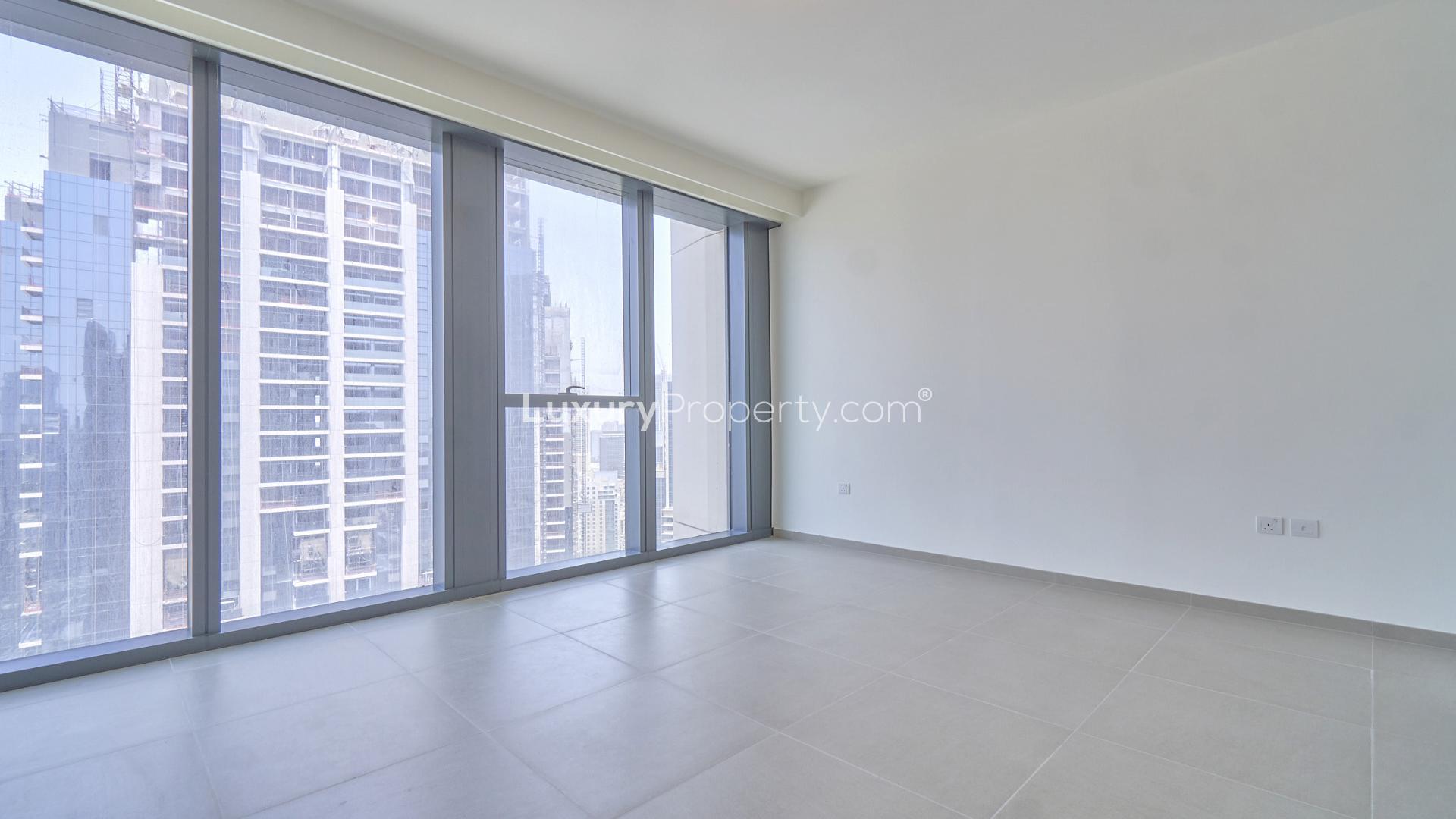 Empty apartment room with large windows, city view, Downtown Dubai, BLVD Heights