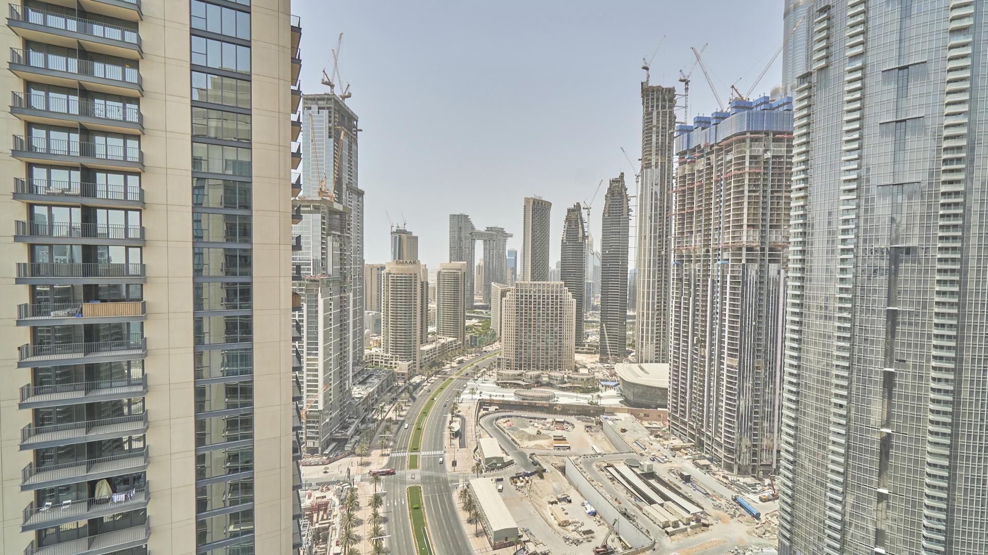 "Bright apartment with city view, large windows, Downtown Dubai, BLVD Heights, available for rent.",Downtown Dubai skyline view from BLVD Heights apartment for rent, spacious cityscape vista