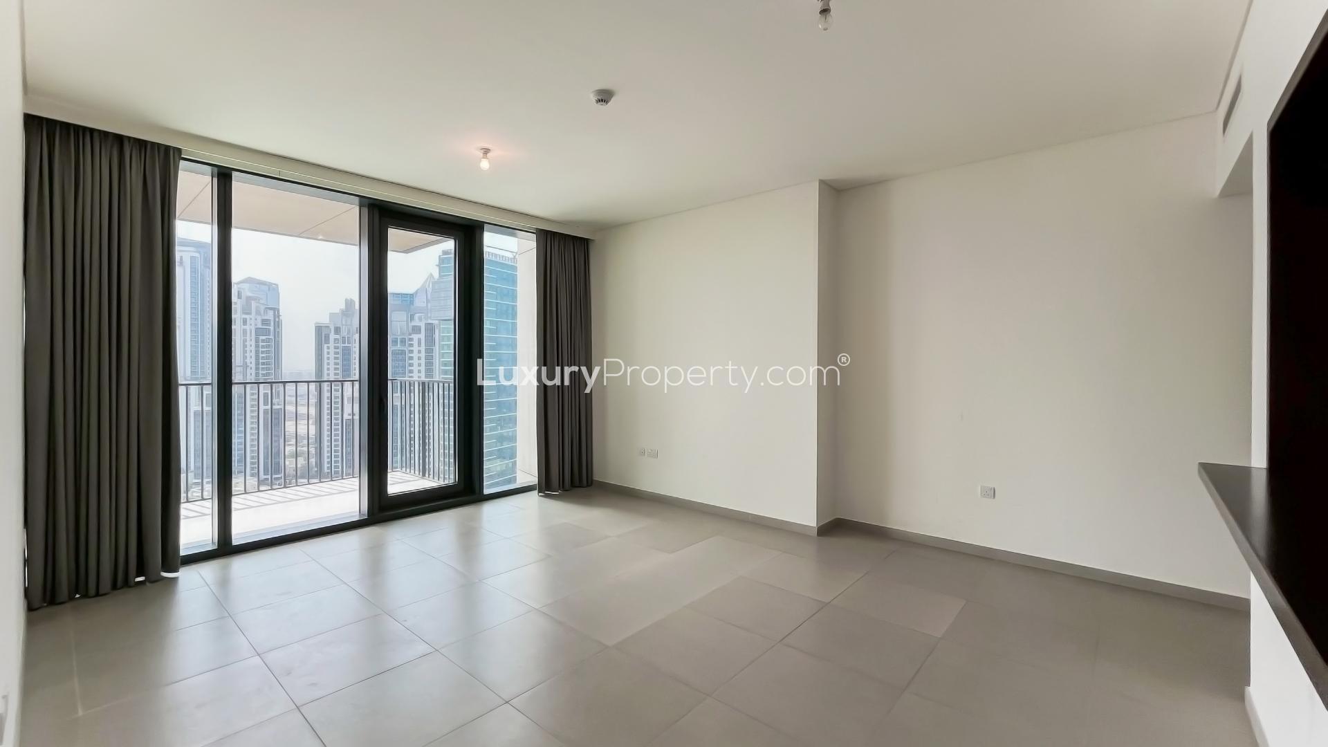 Spacious living area with balcony view in Downtown Dubai apartment, BLVD Heights