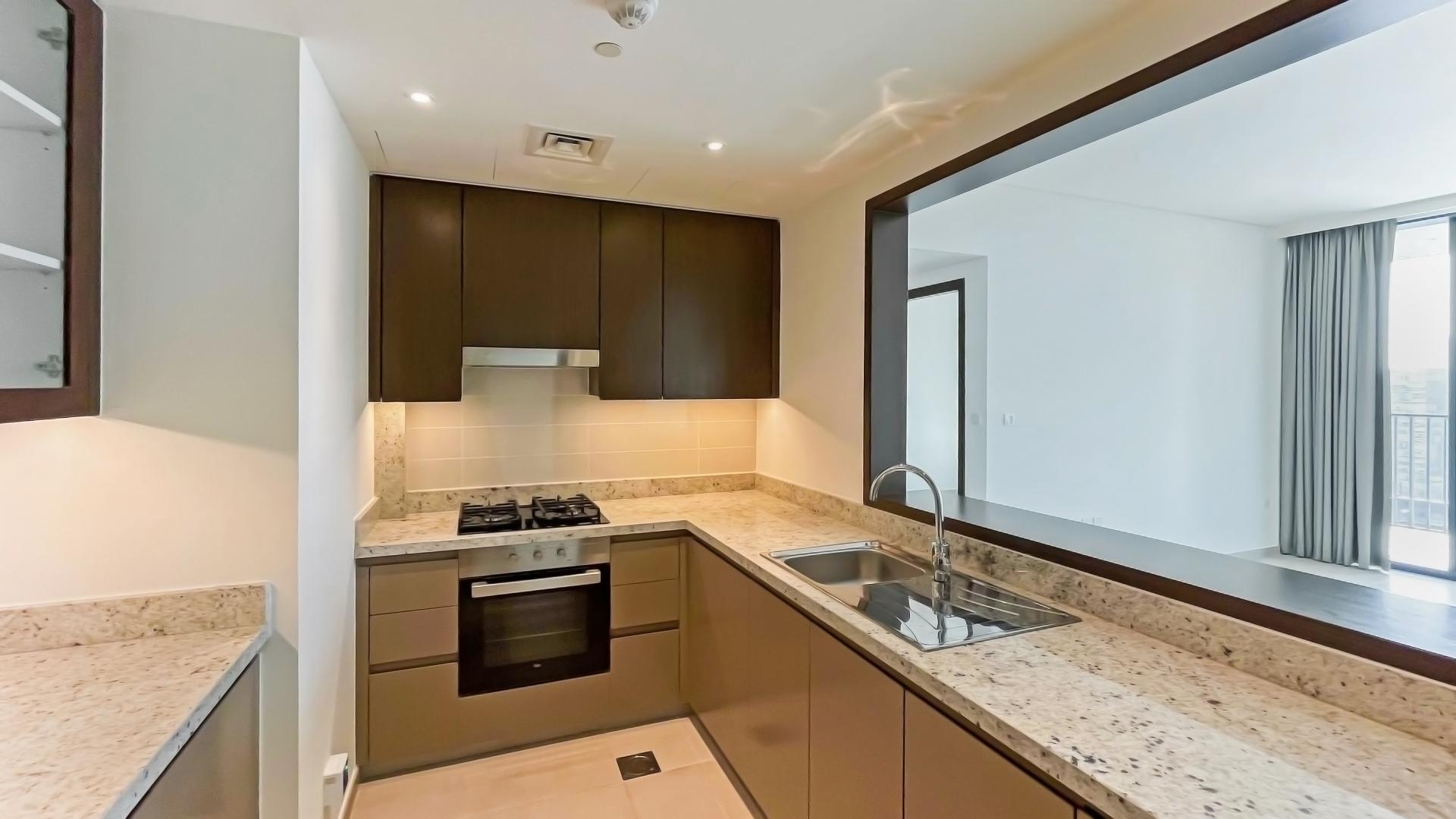 Low-floor apartment interior with open kitchen and spacious living area in BLVD Heights, Dubai
