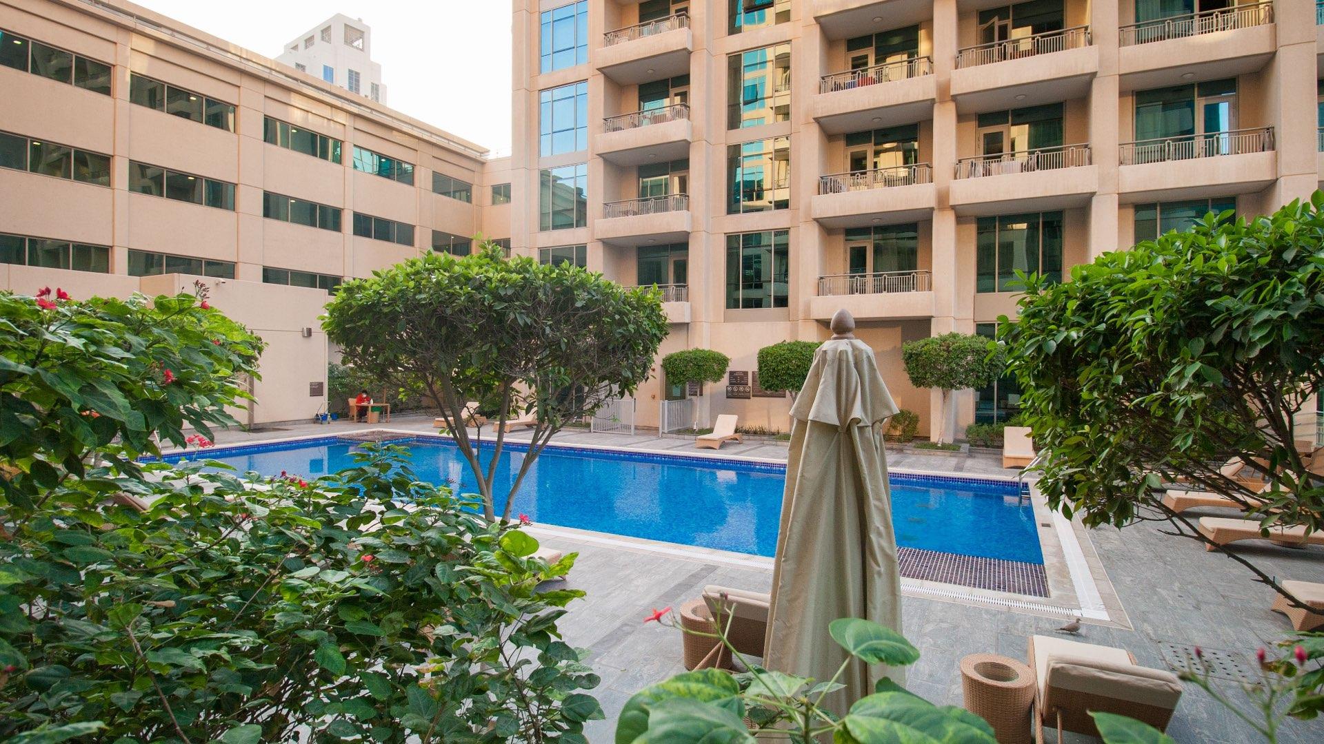 Outdoor pool view from apartment balcony in Downtown Dubai residential building