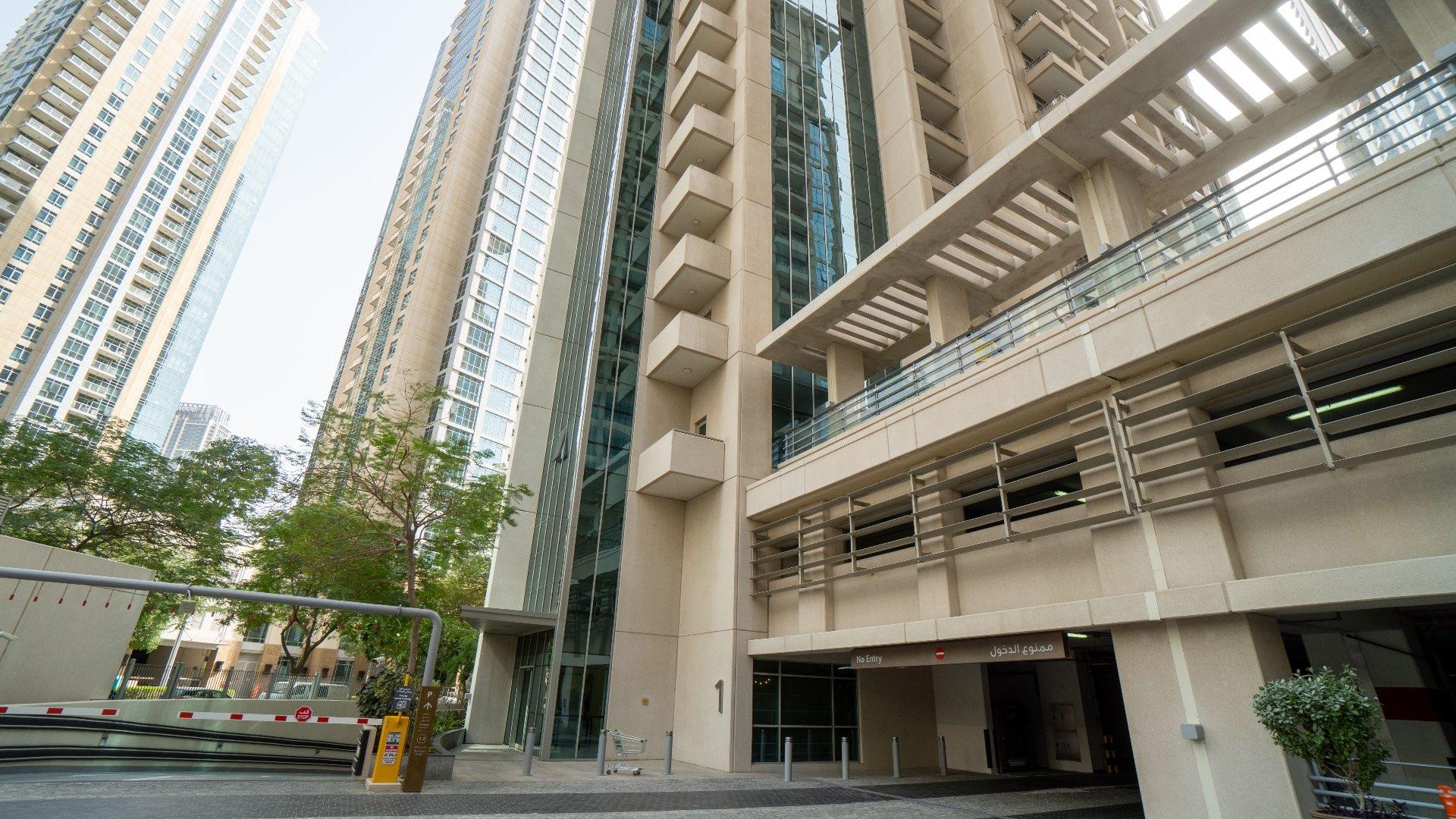 Outdoor swimming pool area at Downtown Dubai apartment complex for sale, LP11398