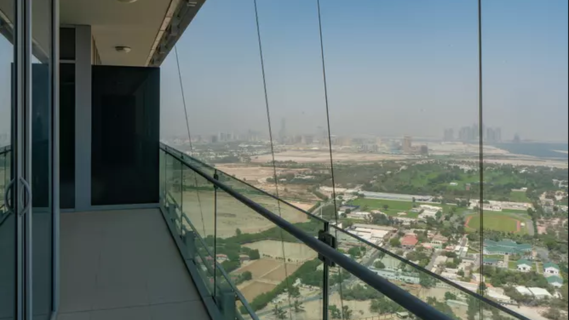 Modern kitchen and living area in 1-bedroom apartment for sale, Burj Daman, DIFC