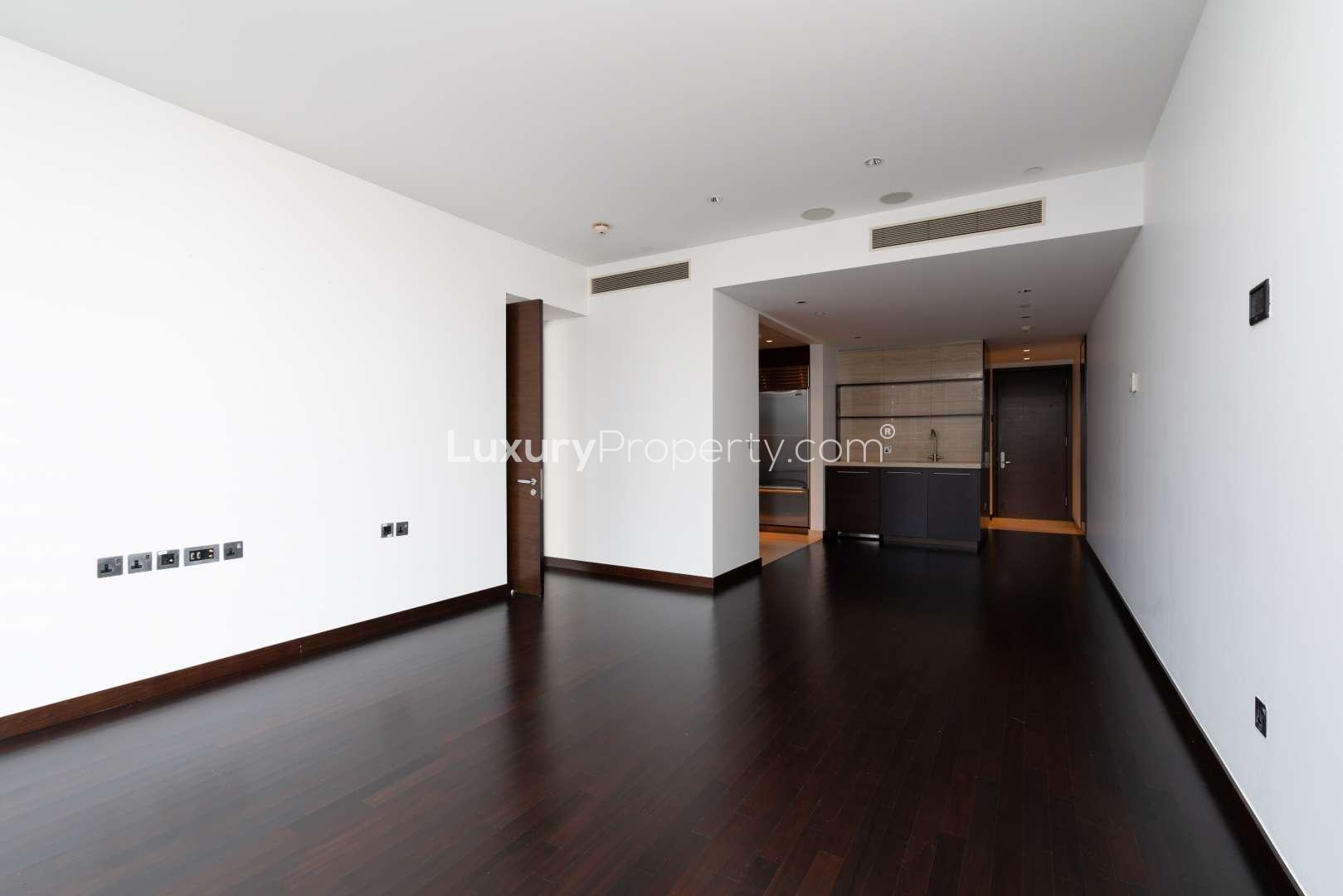 Empty modern living area in Burj Khalifa one-bedroom apartment, Downtown Dubai