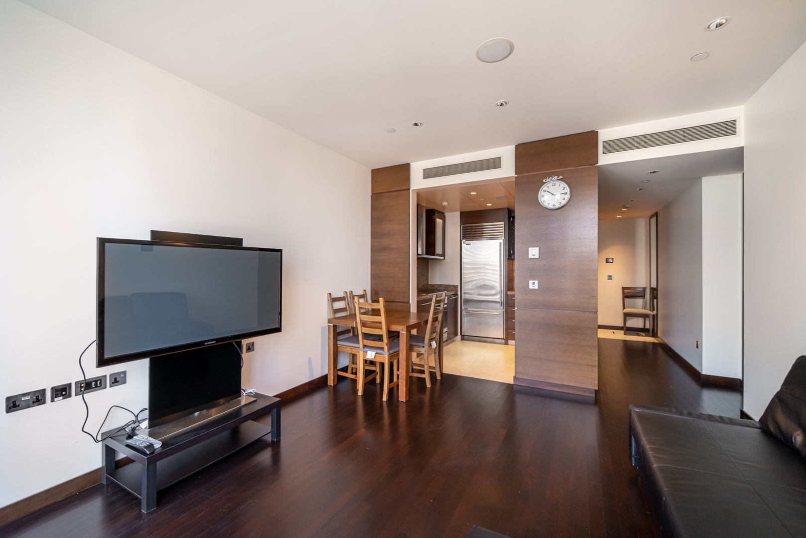 Luxury apartment living room with modern furnishings and large windows in Downtown Dubai