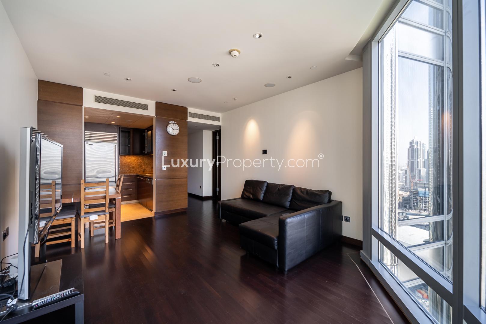 Modern living area in luxury 1-bedroom apartment, Downtown Dubai, with sleek kitchen and dining set