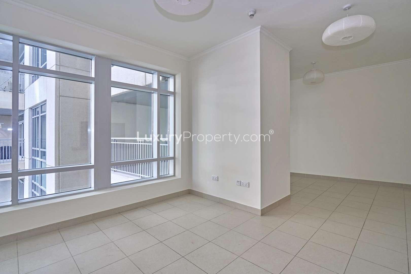 Spacious living area in 1-bedroom apartment, Burj Views, Downtown Dubai, large windows