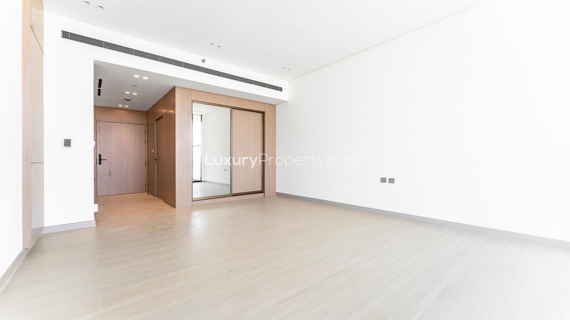 Modern living room in Binghatti Apex apartment, Jumeirah Village Circle, spacious and bright