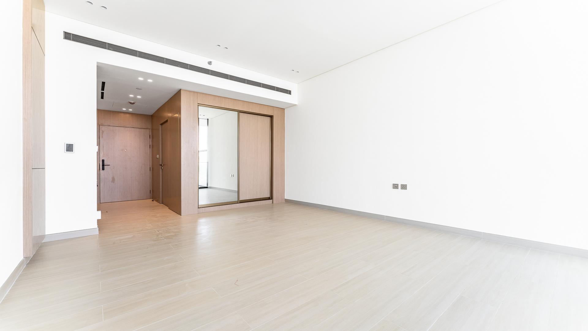 Modern living room in Binghatti Apex apartment, Jumeirah Village Circle, spacious and bright