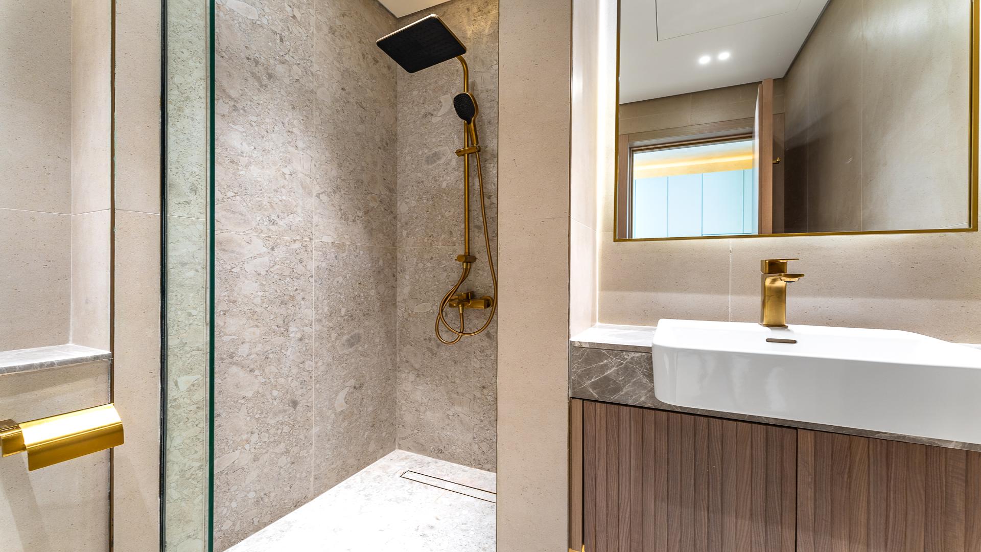 Modern apartment interior in Binghatti Apex, Jumeirah Village Circle, with wooden flooring