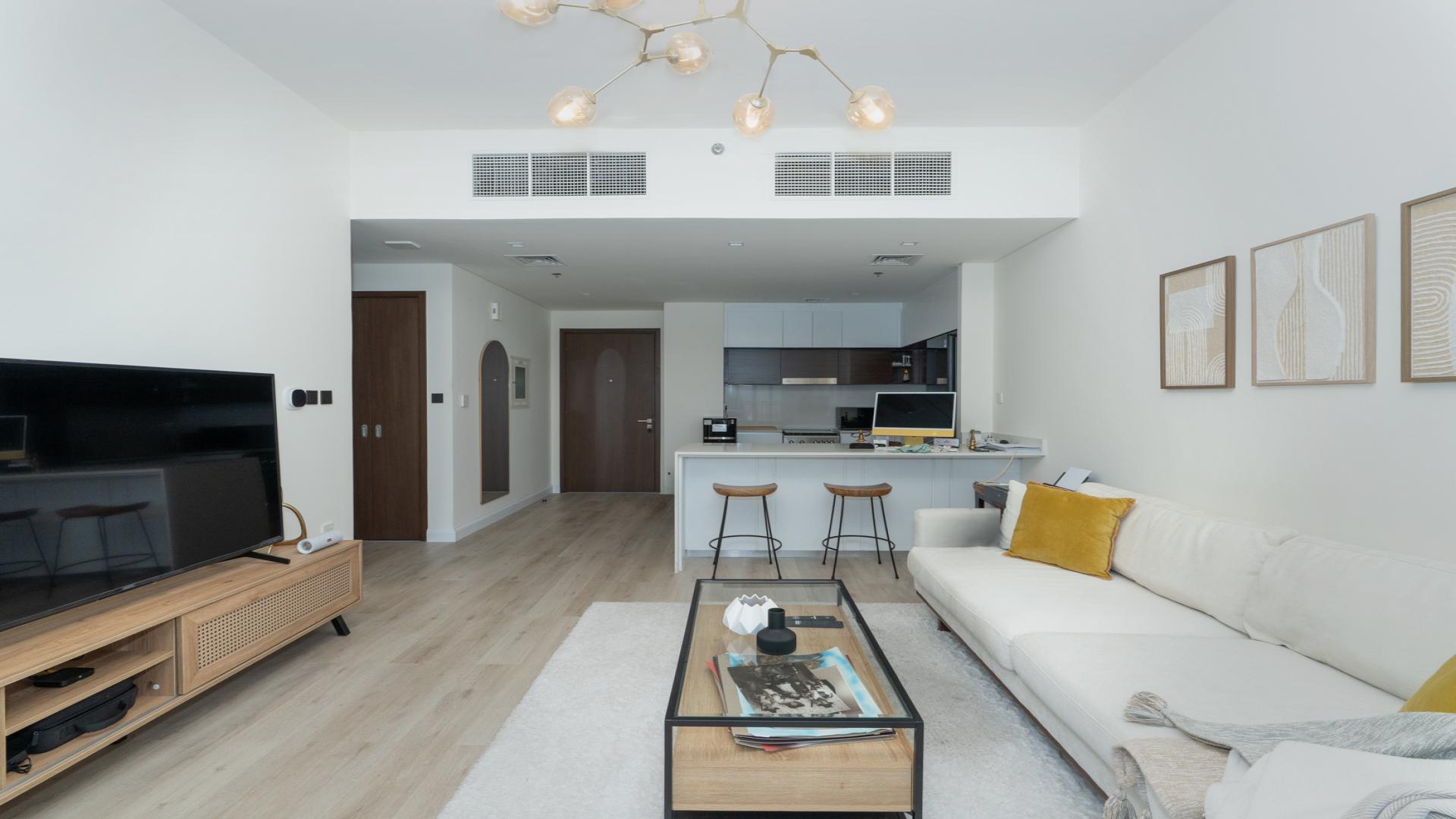 Aerial view of luxury apartment with pool and waterfront in Dubai Creek Harbour