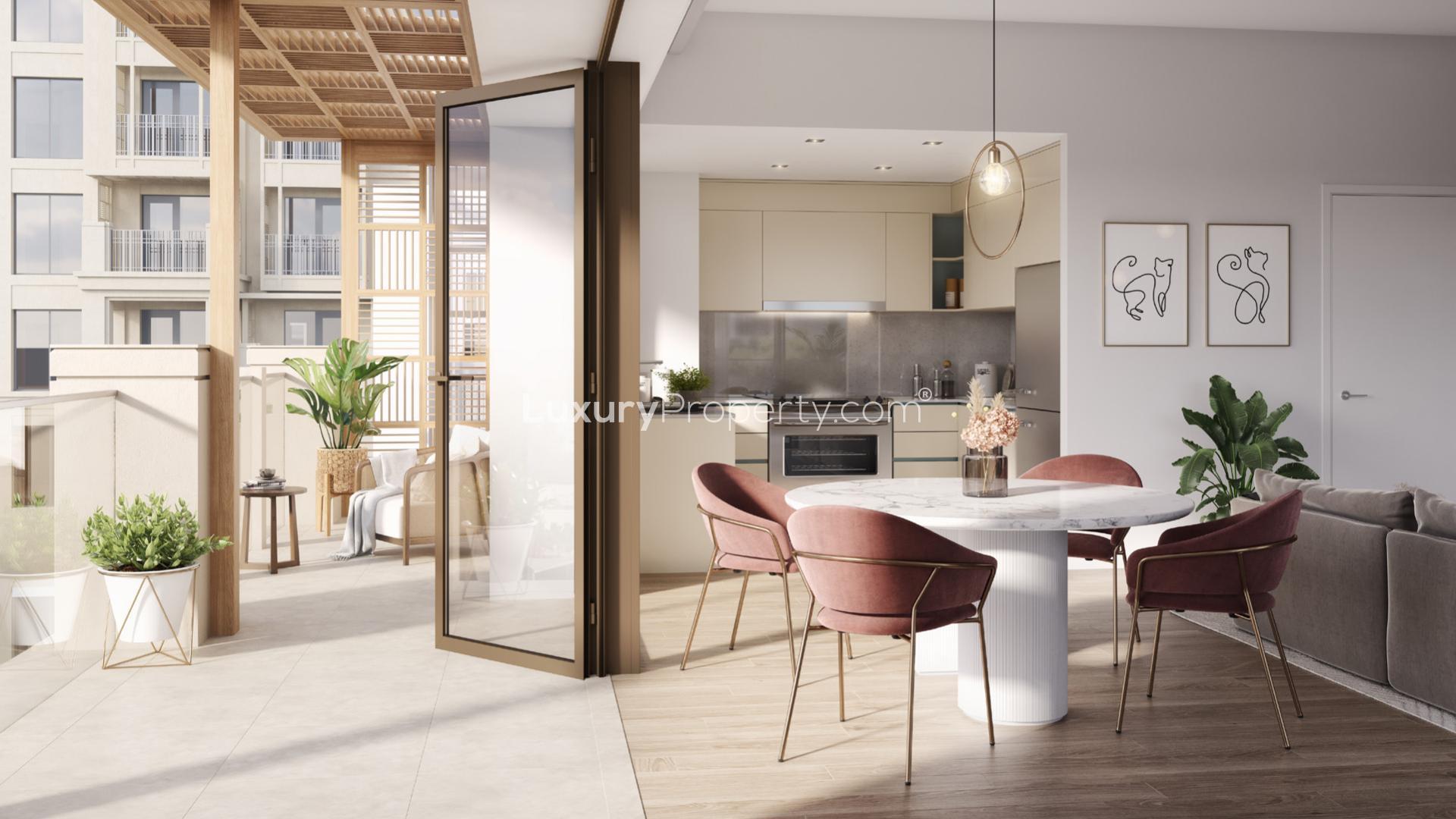 Modern apartment exterior in Dubai Creek Harbour’s vibrant community, featuring palm trees and shops