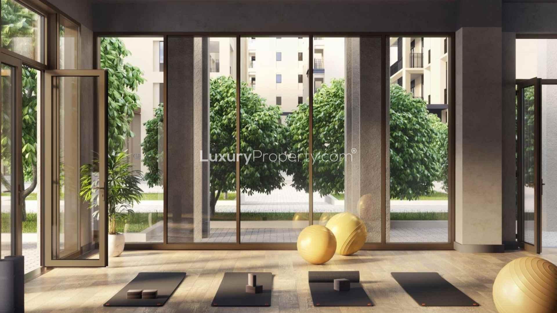 Luxurious bedroom with balcony view in Dubai Creek Harbour apartment for sale