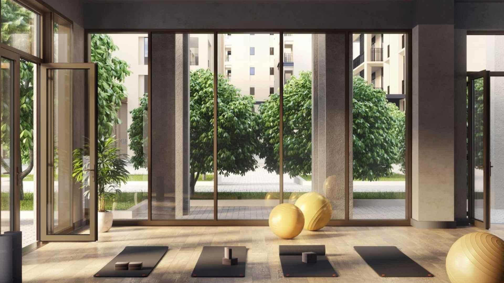 Luxurious bedroom with balcony view in Dubai Creek Harbour apartment for sale