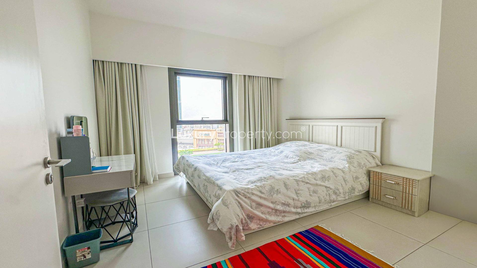 Vacant furnished bedroom in Burj Crown apartment, Downtown Dubai, with city view window