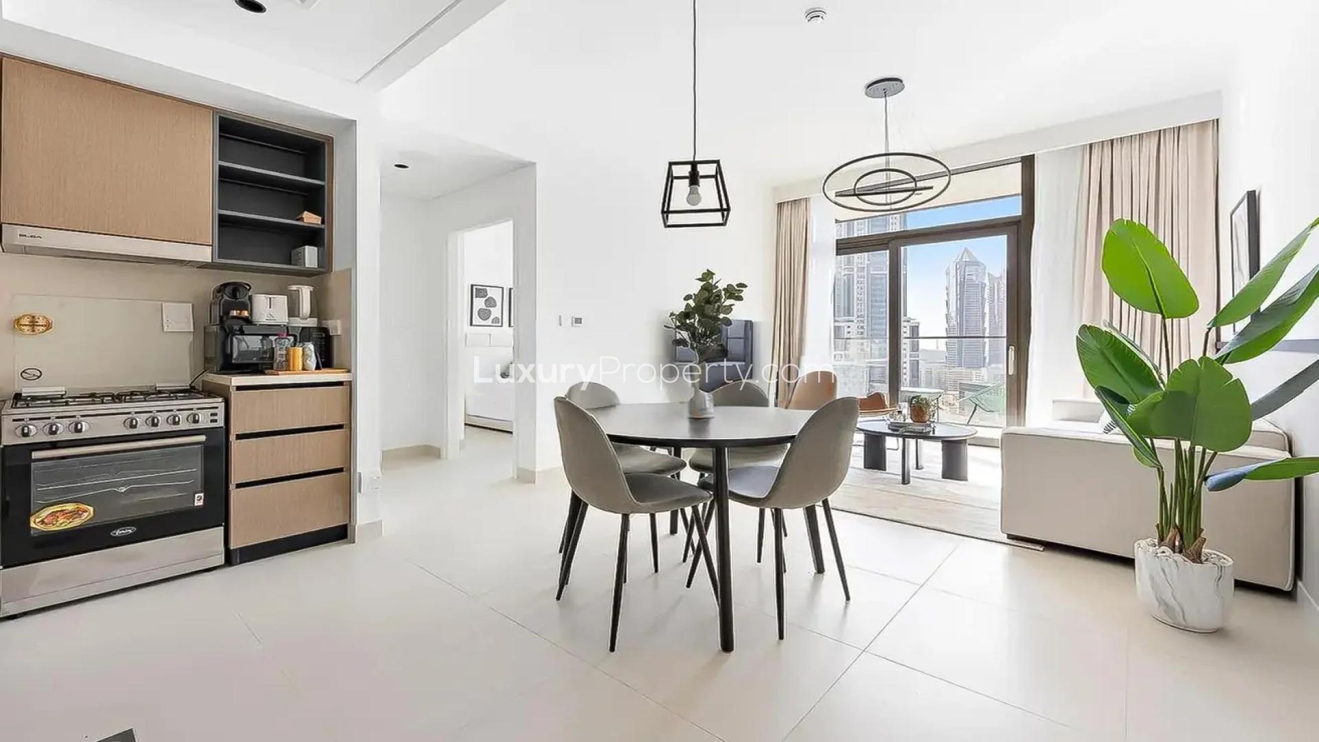 Modern living room in Burj Crown apartment, Downtown Dubai, with balcony and city views