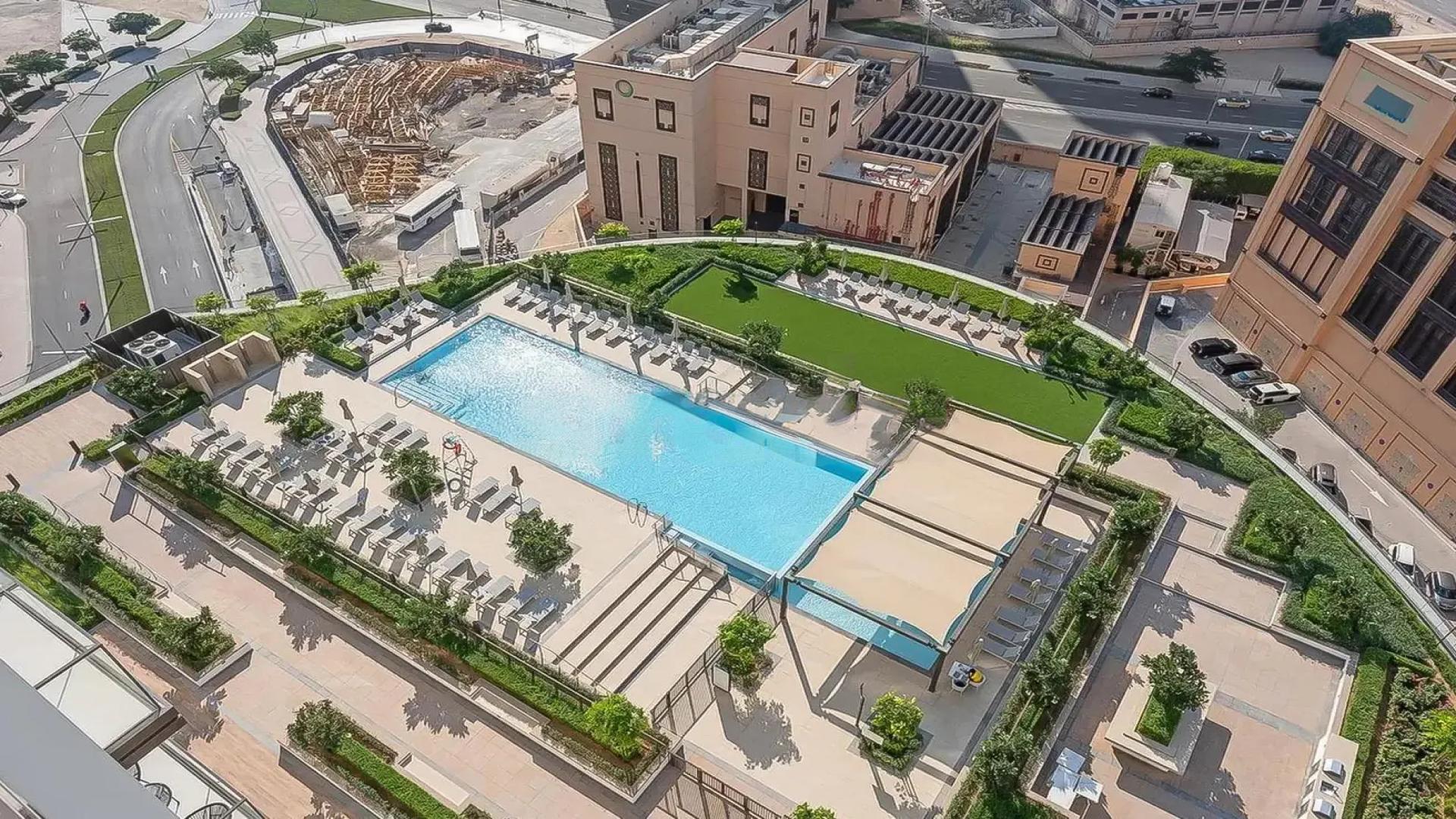 Modern bedroom in Burj Crown apartment, Downtown Dubai, with city view and elegant decor