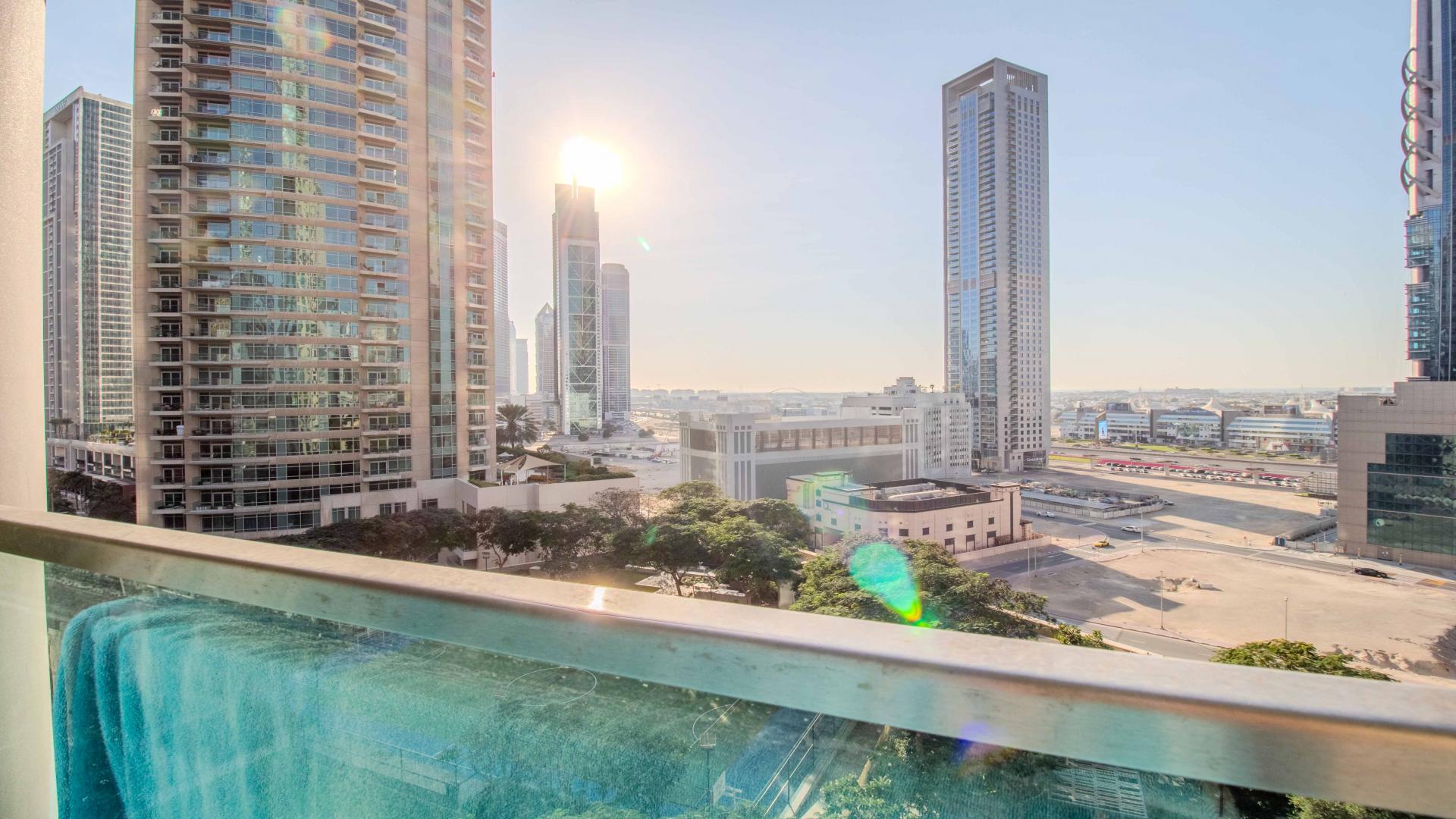 Luxurious living room in Burj Vista apartment, Downtown Dubai, with modern decor and city views