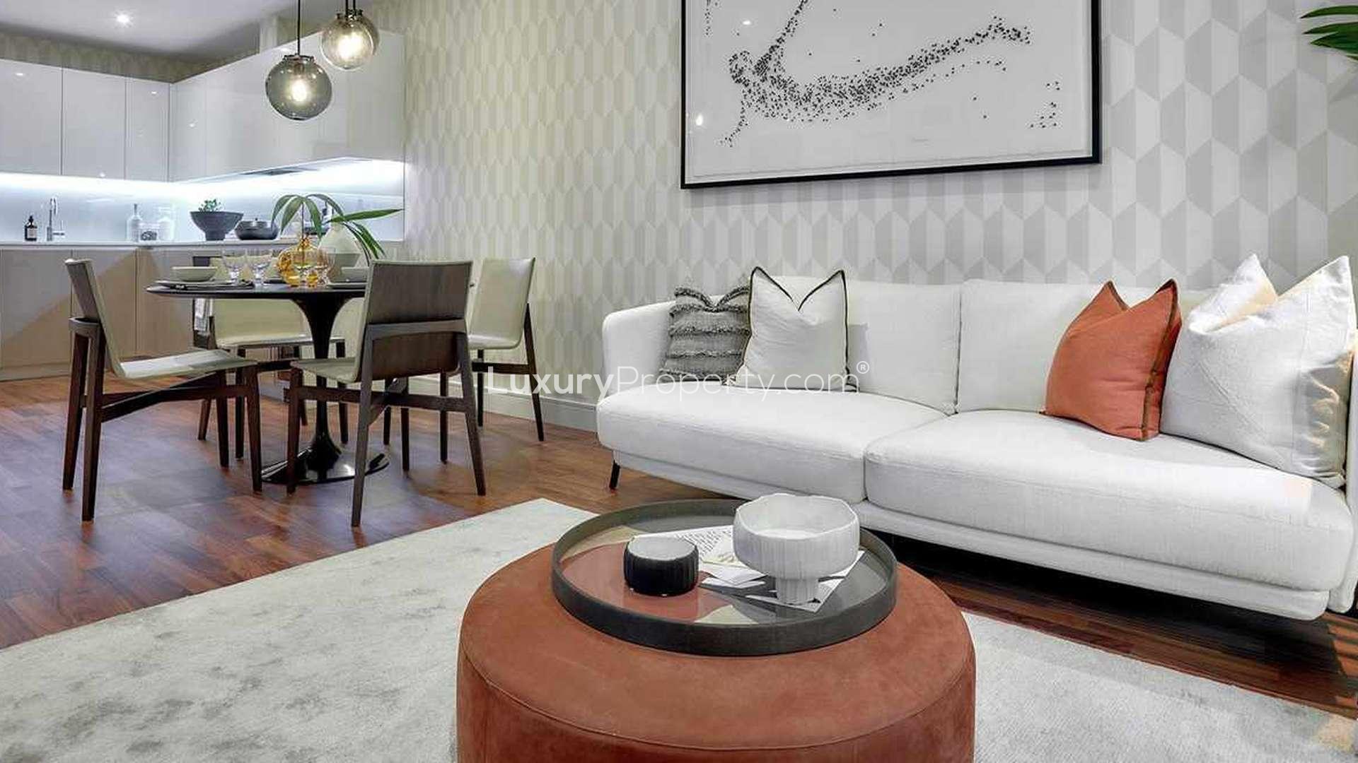 Modern kitchen and dining area in Discovery House luxury apartment, Battersea Reach