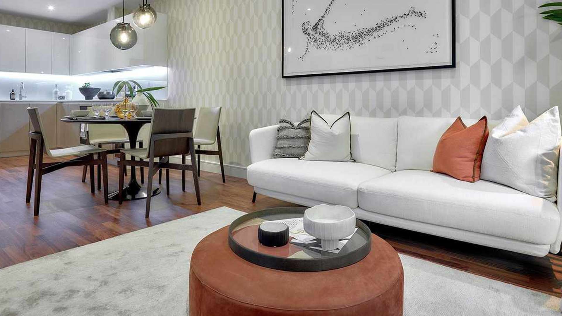 Modern kitchen and dining area in Discovery House luxury apartment, Battersea Reach