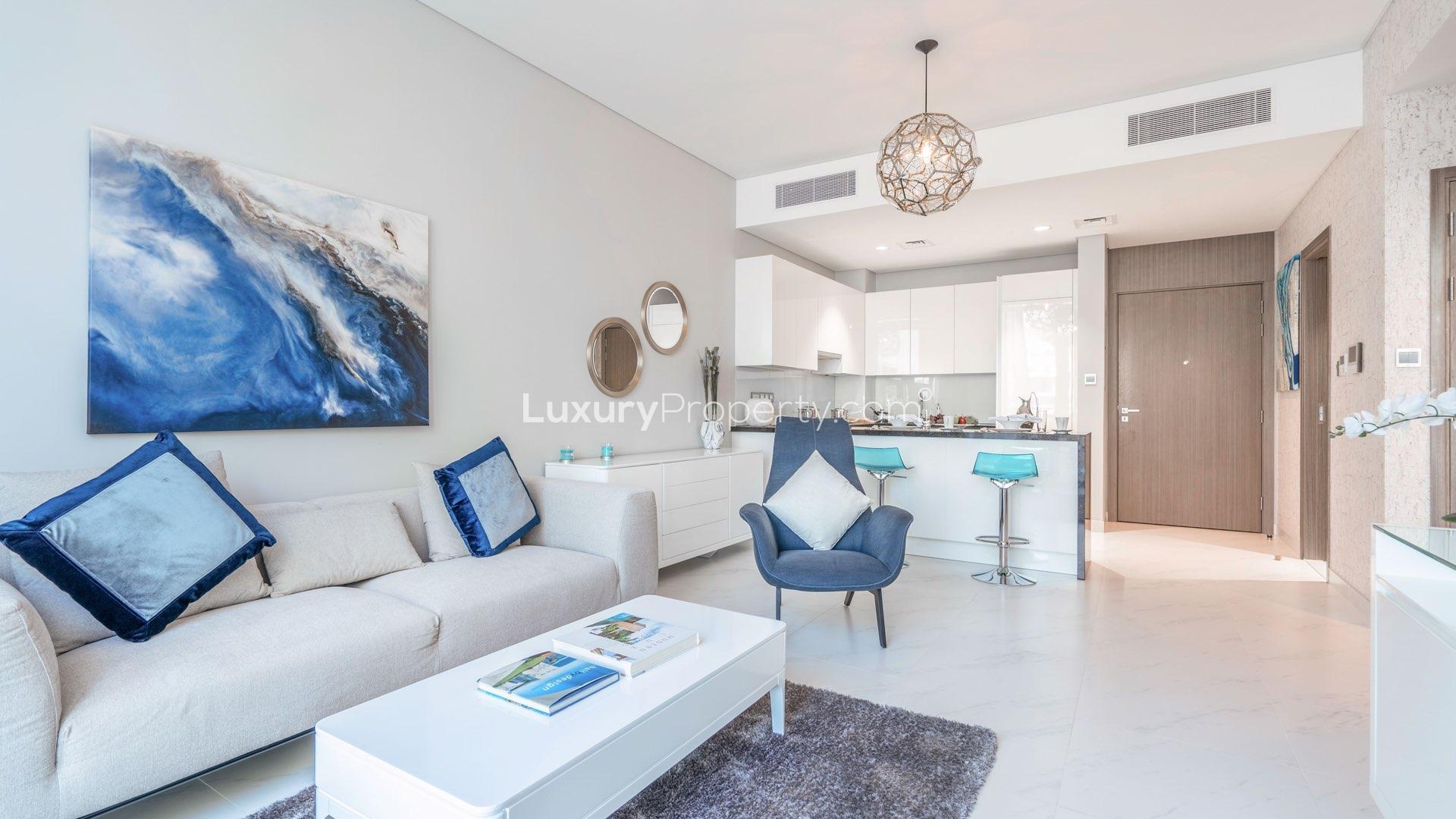 Stylish living room in District One apartment, featuring modern decor and natural light