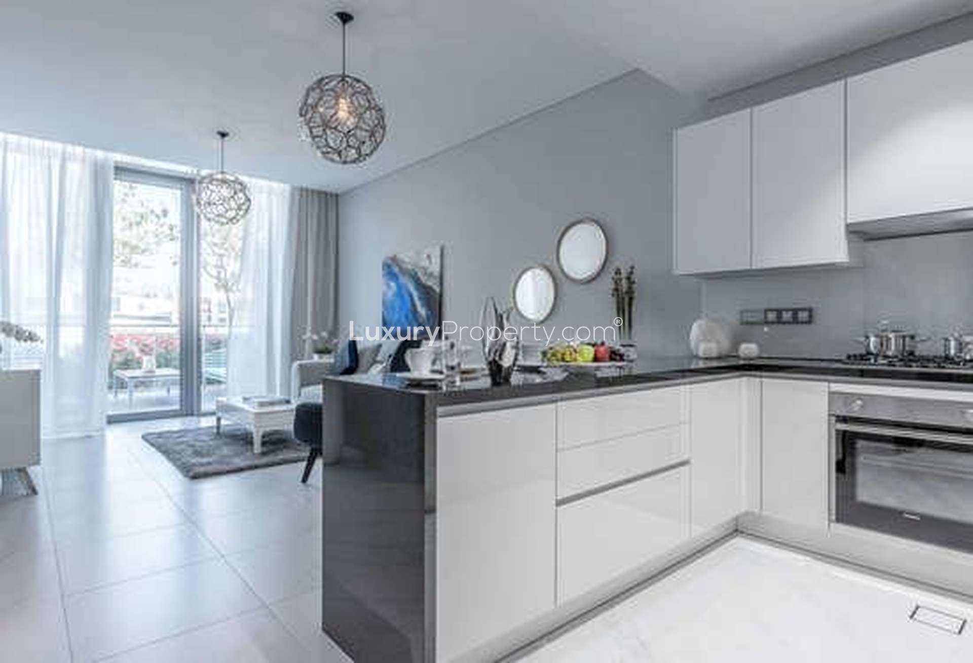 Modern living room in District One apartment, MBR City, with elegant furnishings and natural light