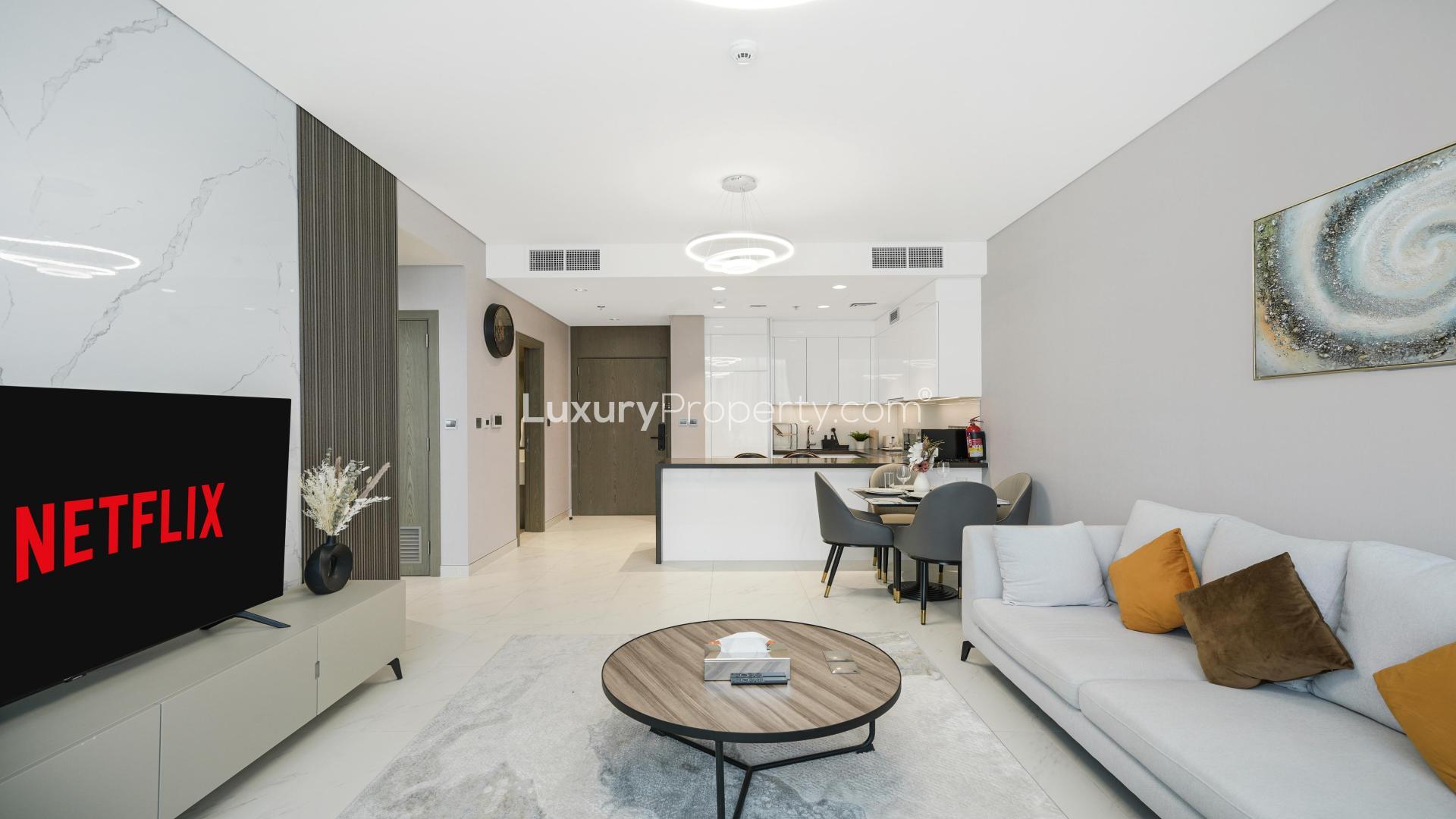 Modern living room in fully furnished 1-bedroom apartment, District One Phase III, for sale