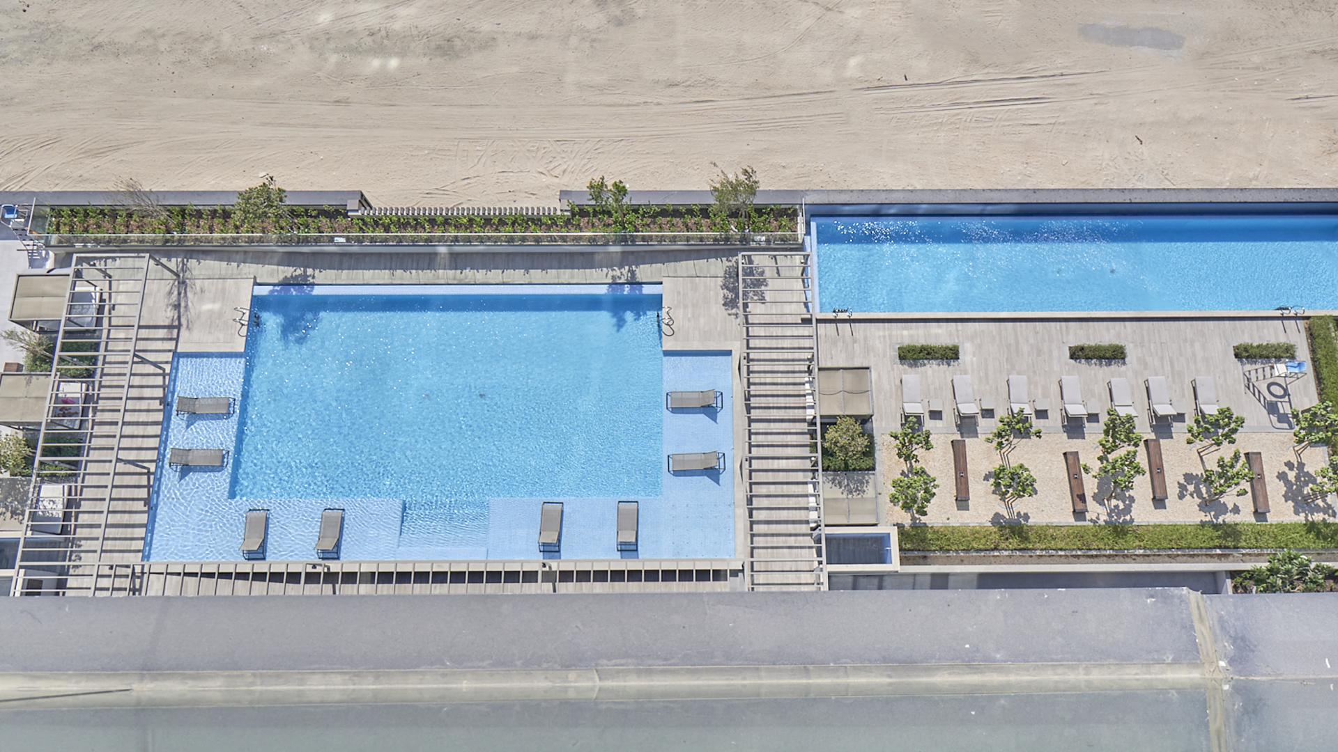 Low-floor apartment balcony view of Downtown Dubai skyline and Burj Khalifa Street