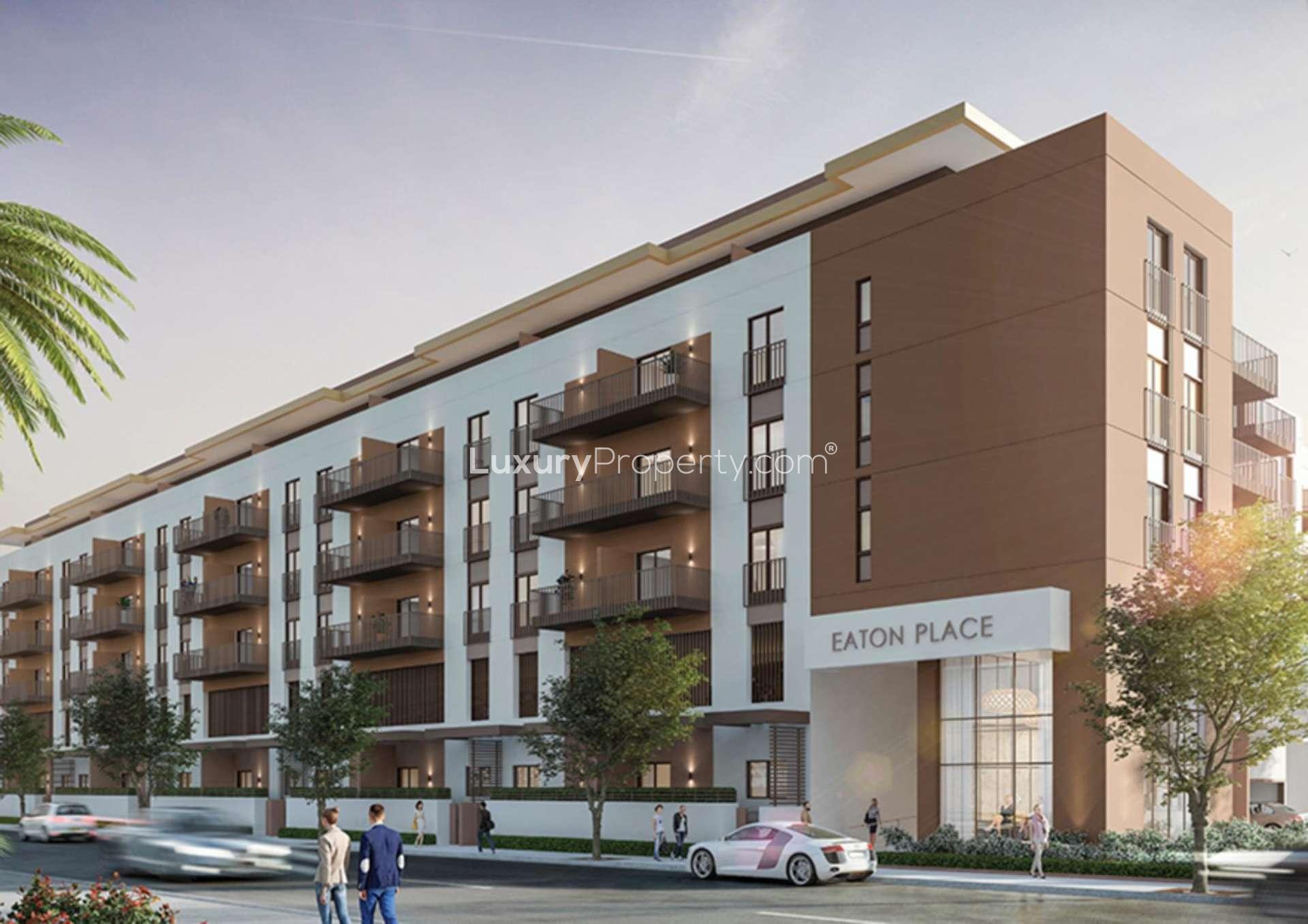 Contemporary apartment lobby at Eaton Place, Jumeirah Village Circle, featuring modern elevators