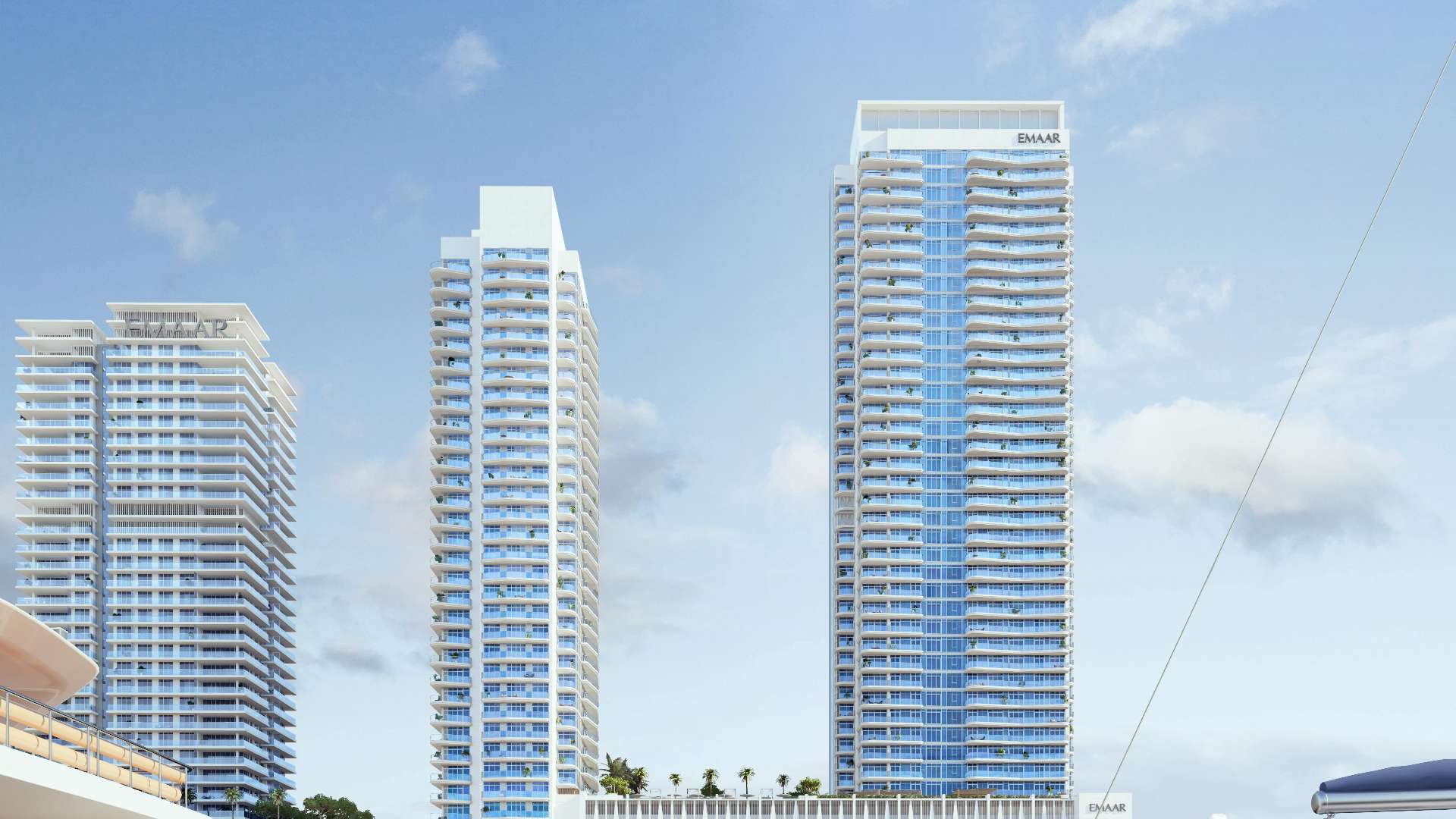 Luxurious poolside view overlooking Dubai skyline at Emaar Beachfront apartment for sale