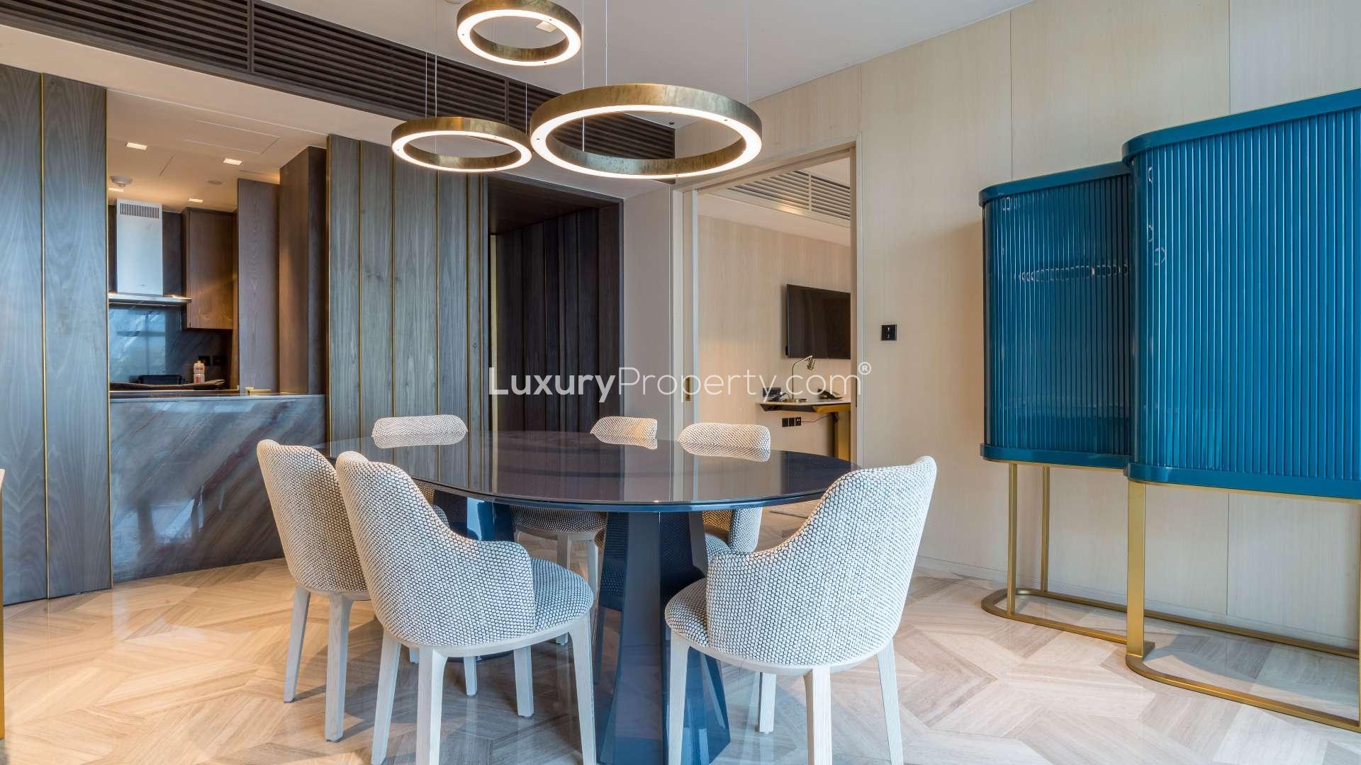 Balcony view from 1-bedroom apartment in Five Palm Jumeirah overlooking city skyline and waterfront