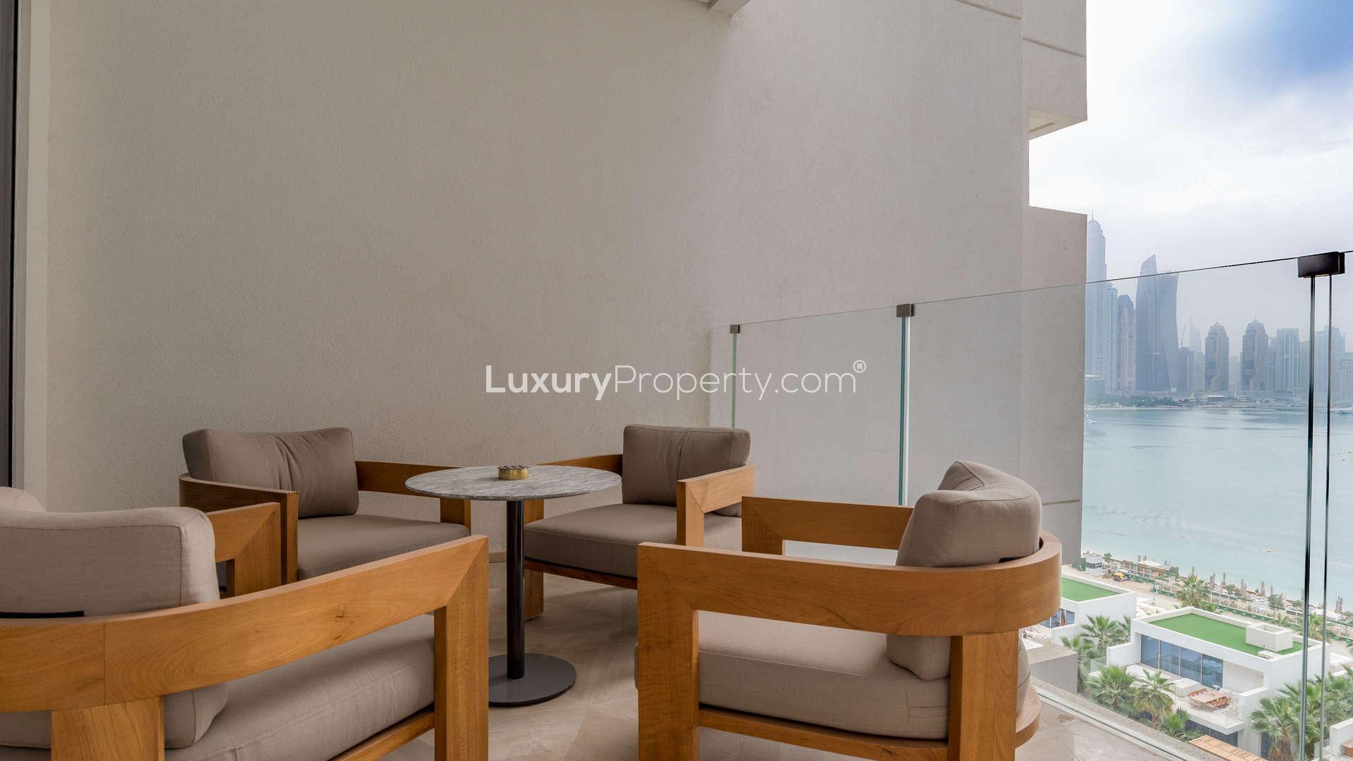 Modern dining area with city views in Five Palm Jumeirah waterfront apartment for sale