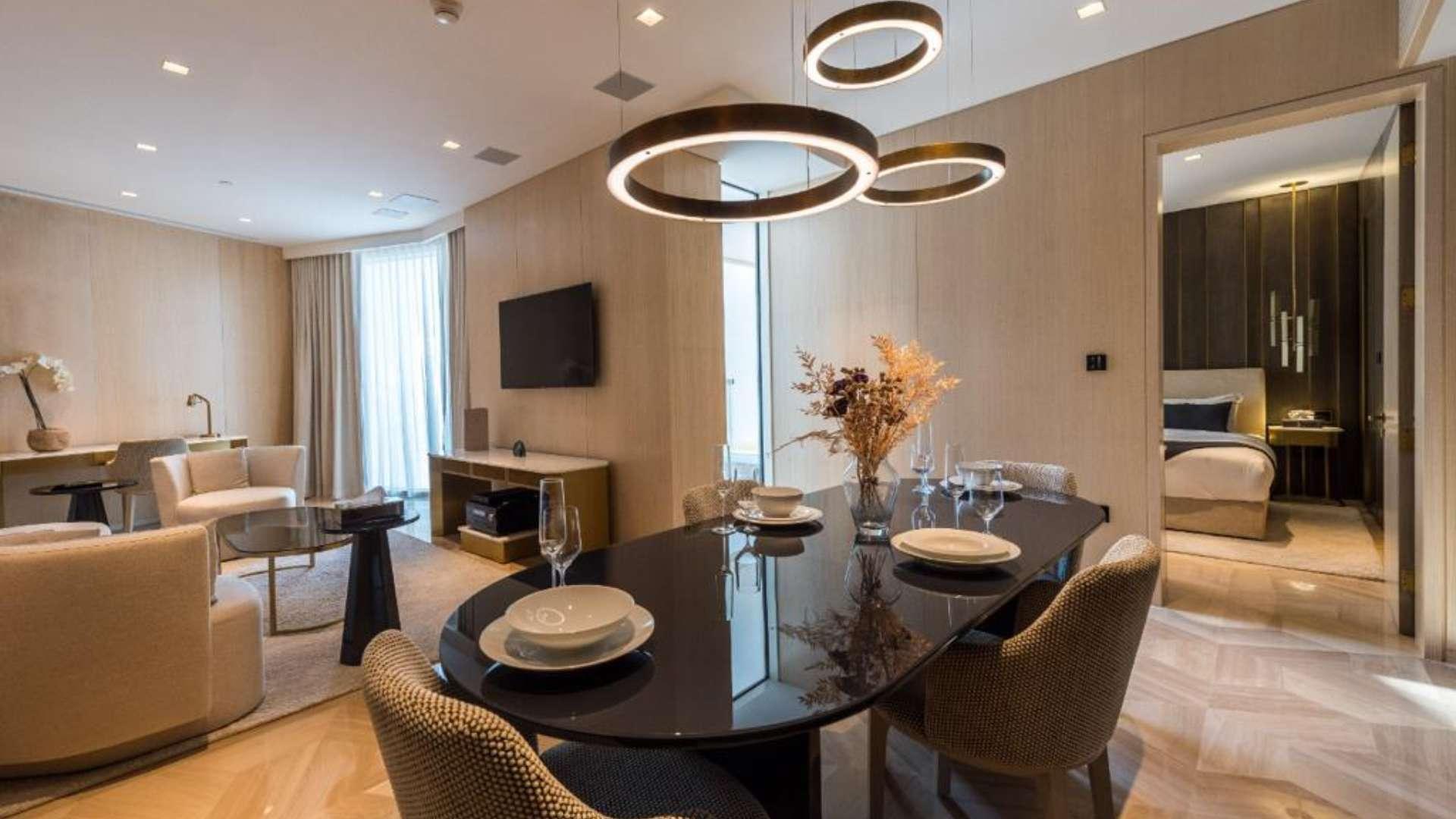 Luxurious living room in Five Palm Jumeirah apartment, modern decor, elegant furniture