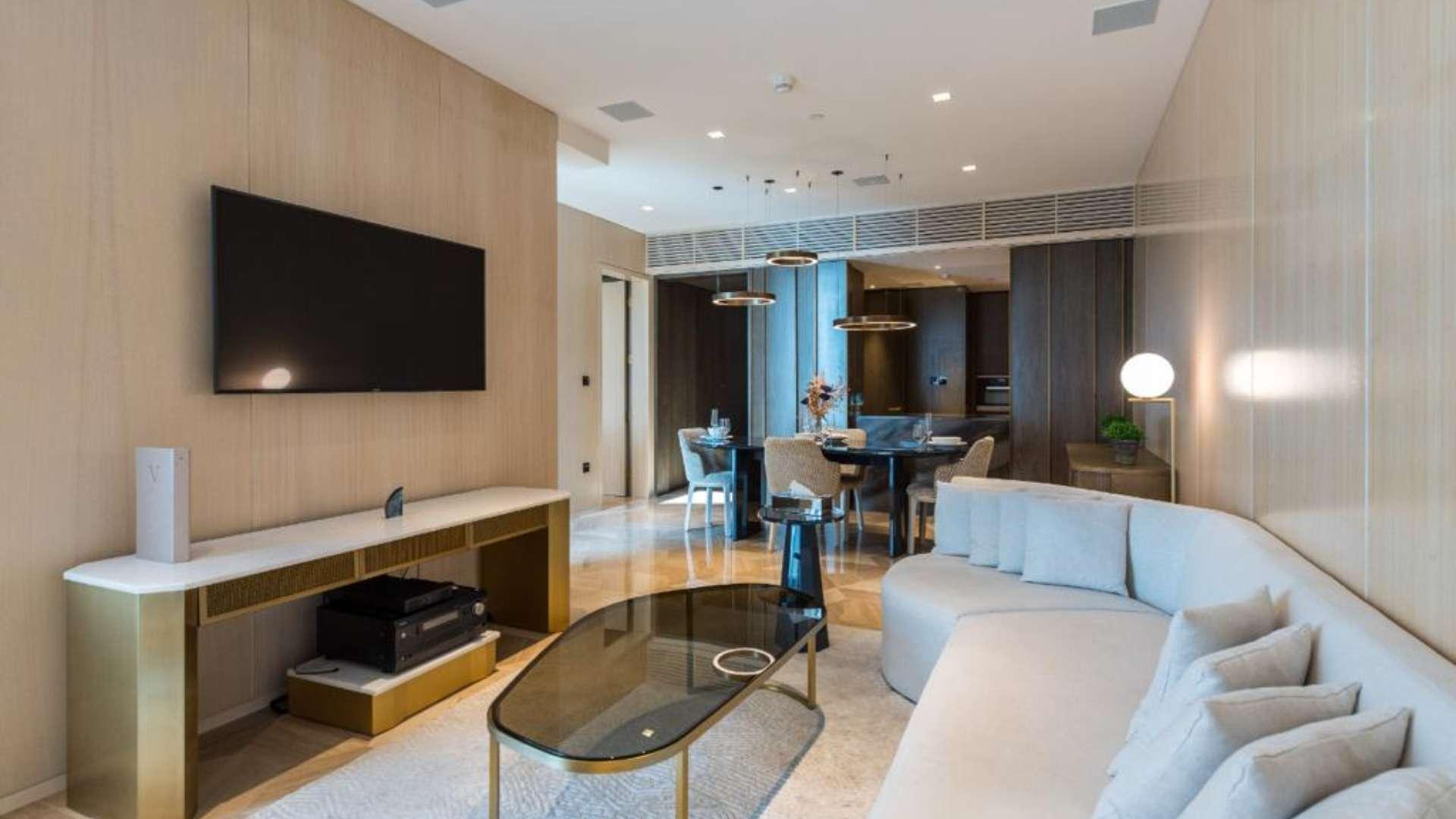 Luxurious living room in Five Palm Jumeirah apartment, elegant decor, spacious layout