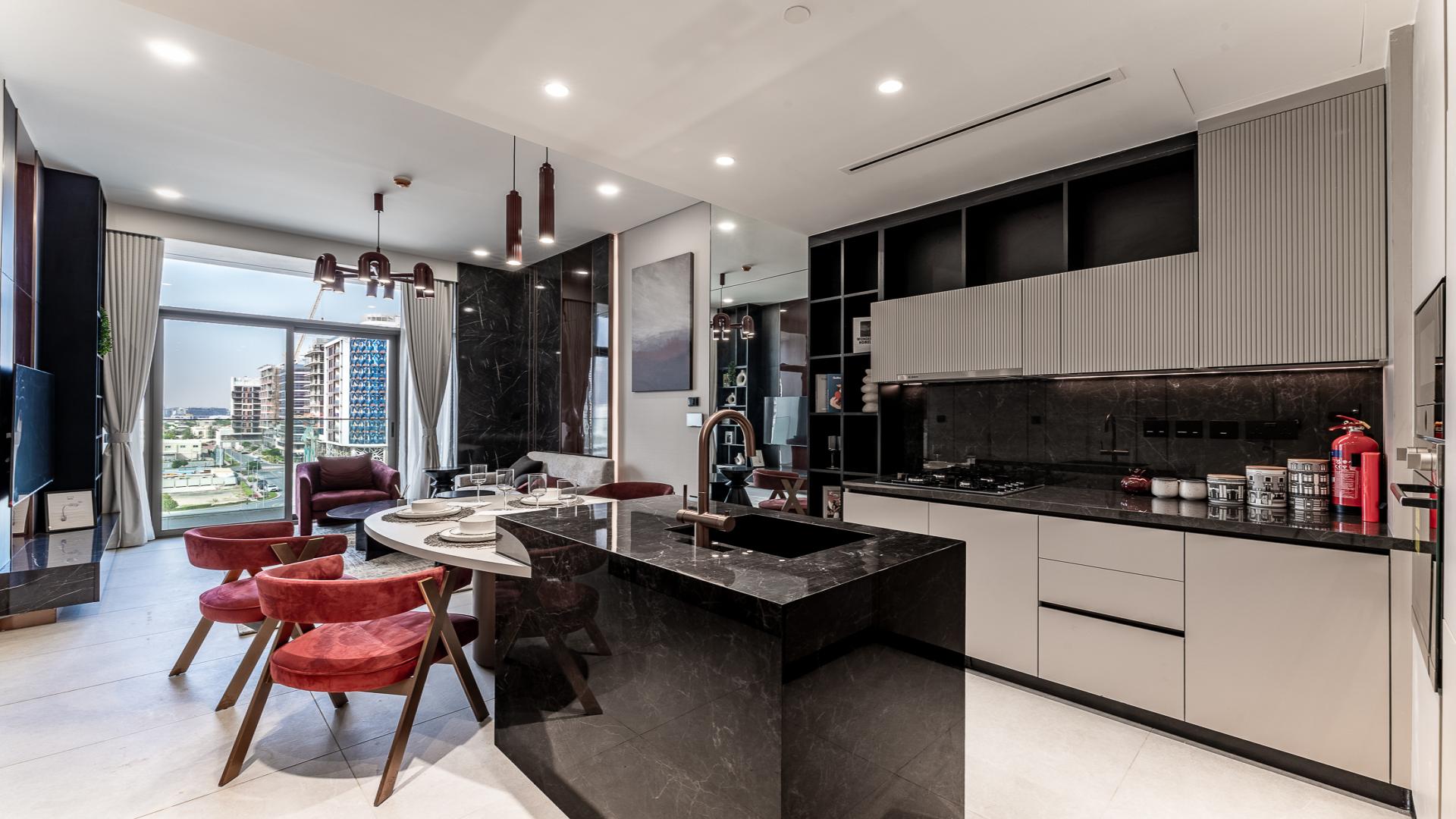 Modern kitchen and living area in Jumeirah Garden City apartment, Al Satwa
