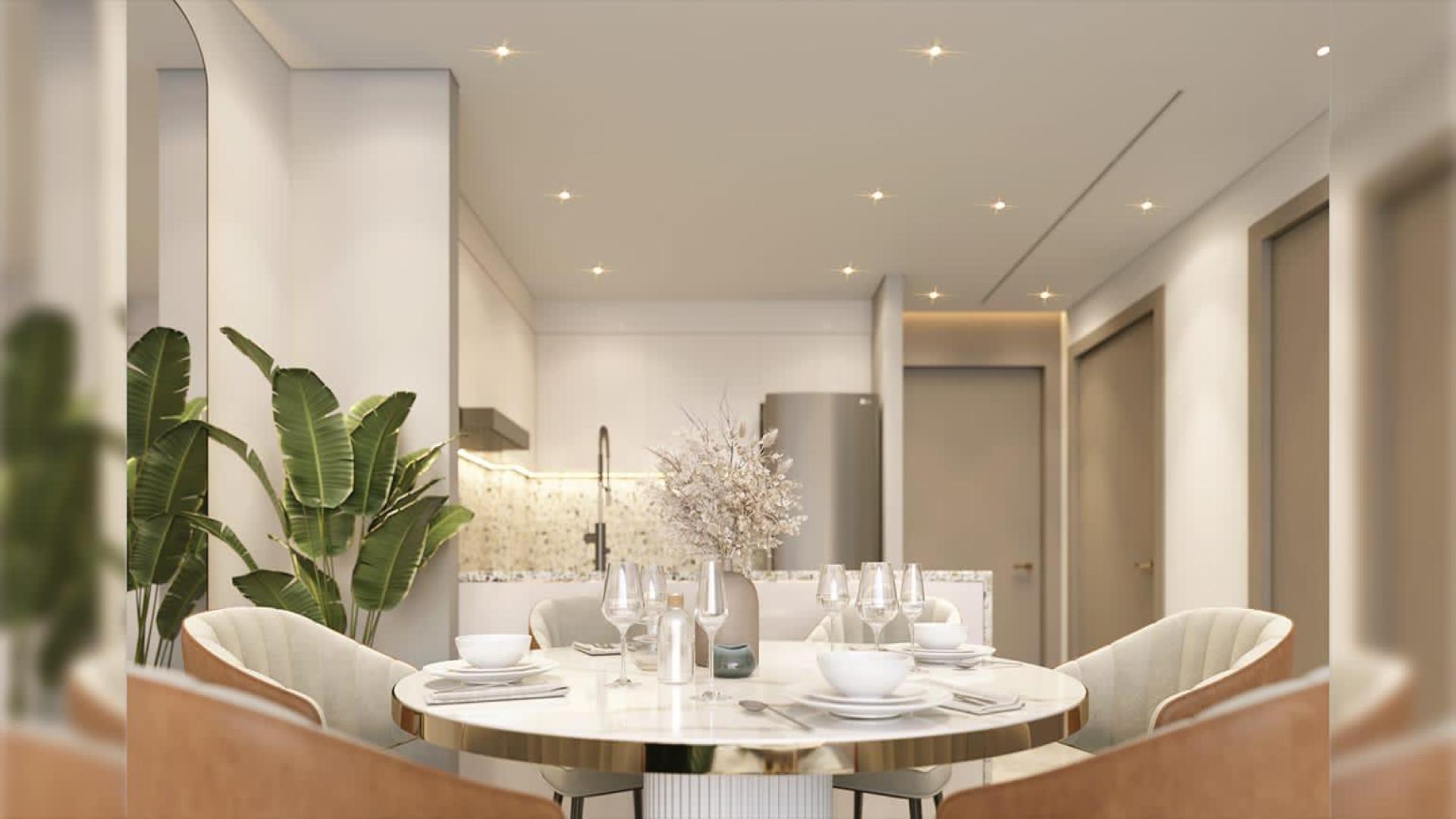 Outdoor pool area at Neva Residences, Jumeirah Village Circle, with modern loungers and greenery