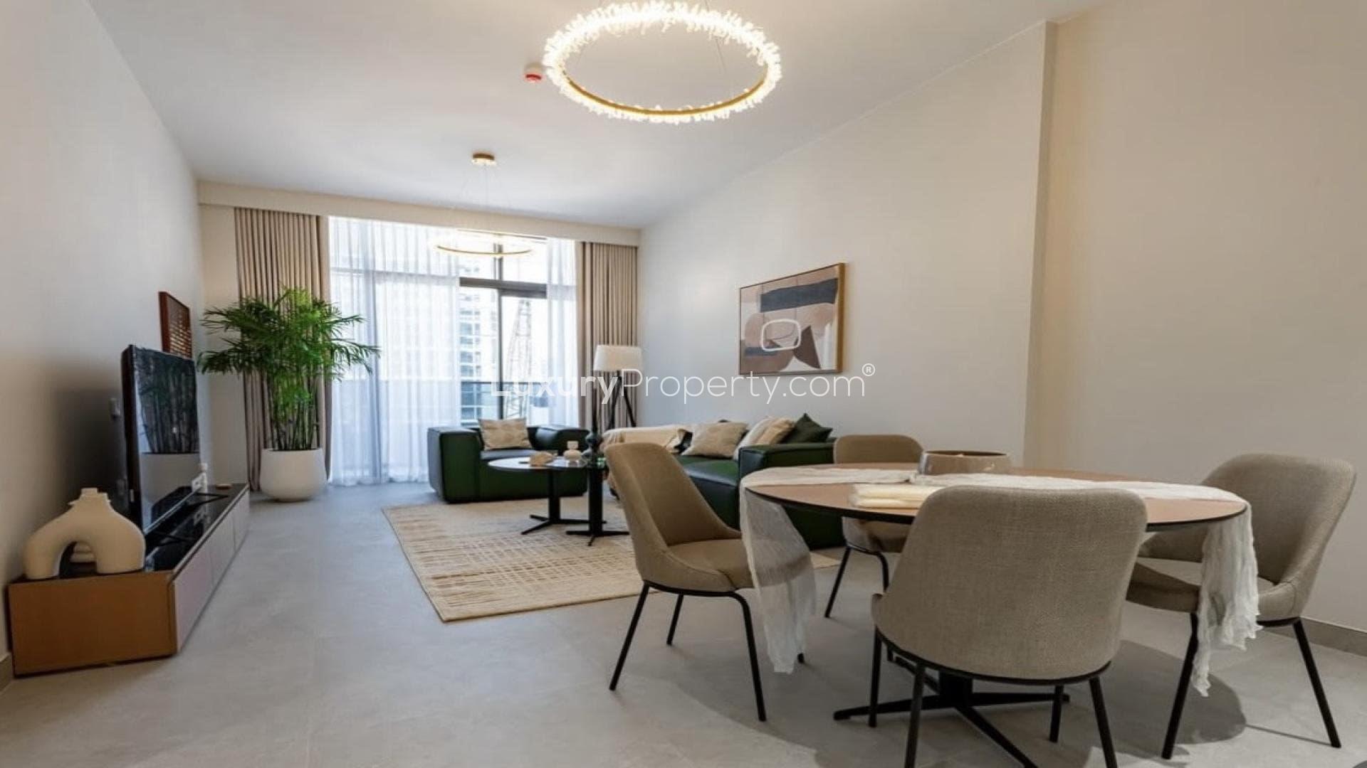 High-floor Neva Residences apartment living room, modern decor, large windows, Jumeirah Village Circle