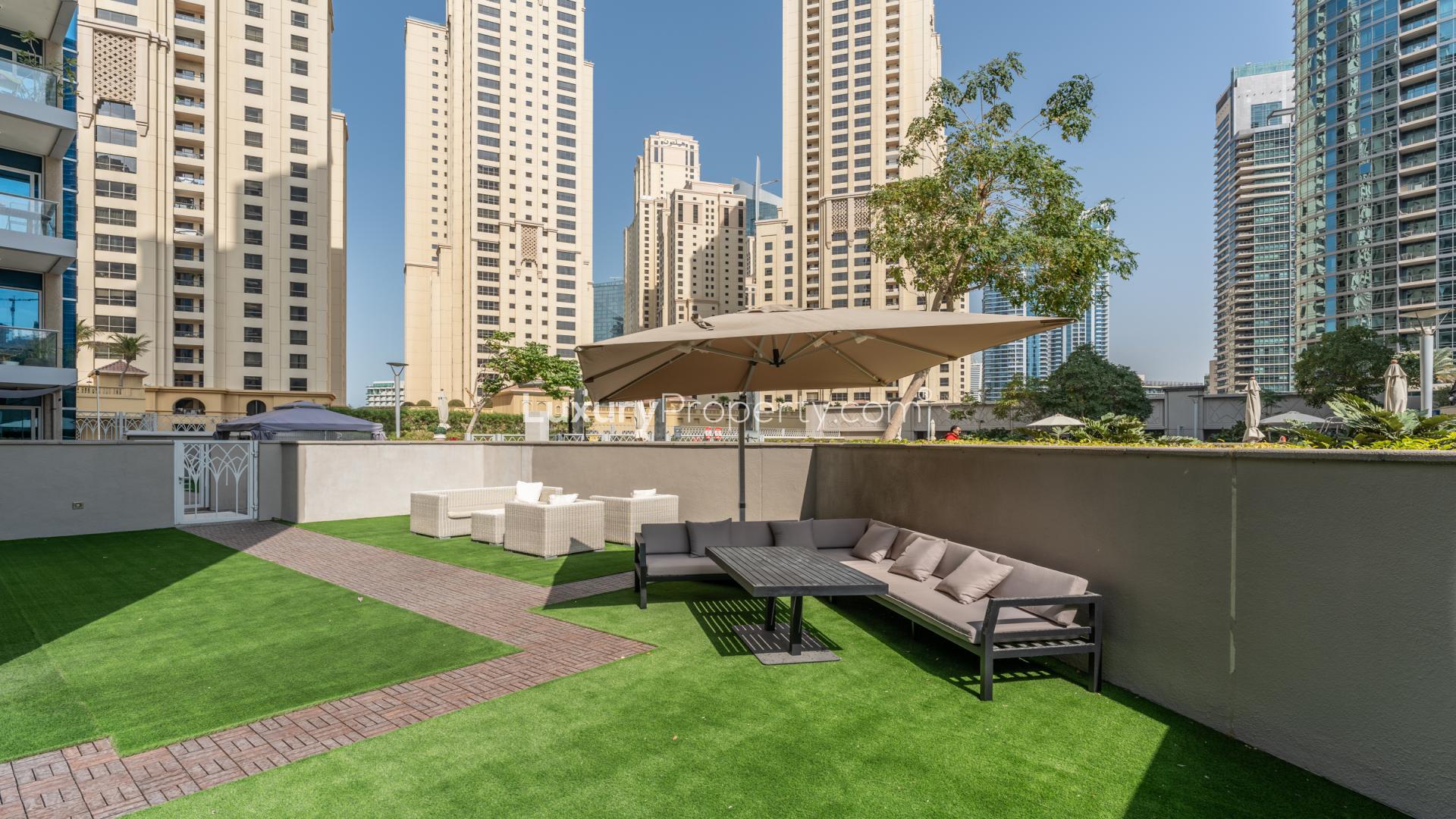 Upgraded furnished living room with large terrace view in Marina Promenade apartment, Dubai Marina