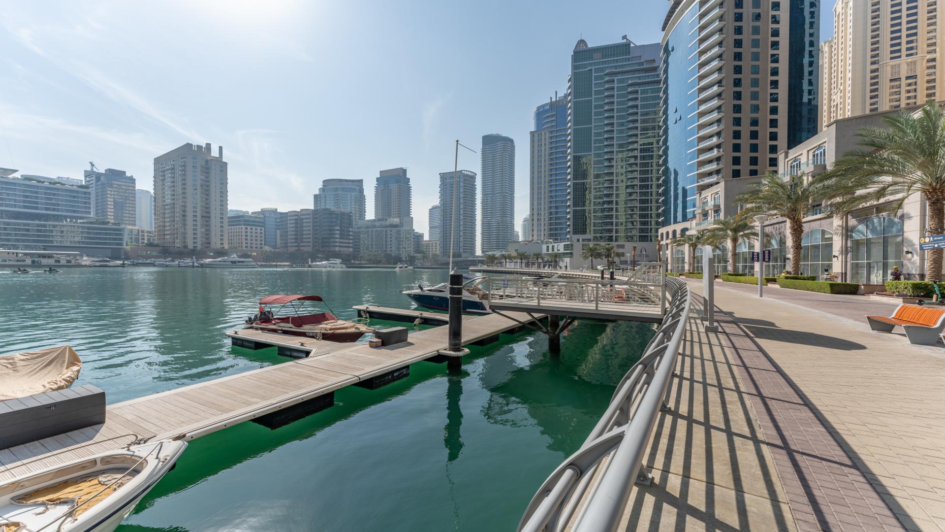 High-floor apartment balcony with marina and skyscraper views in Dubai Marina Promenade