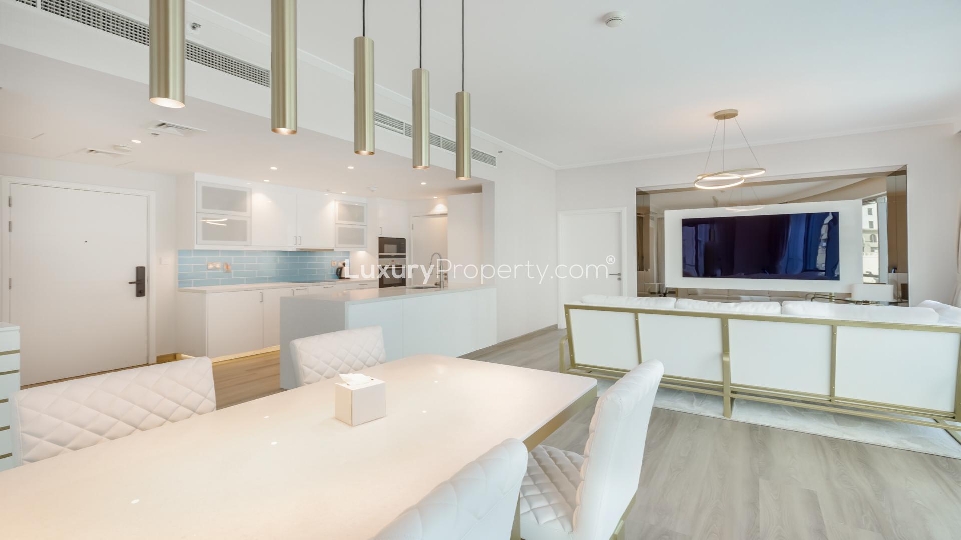 Modern furnished dining and living area in Dubai Marina apartment with large windows