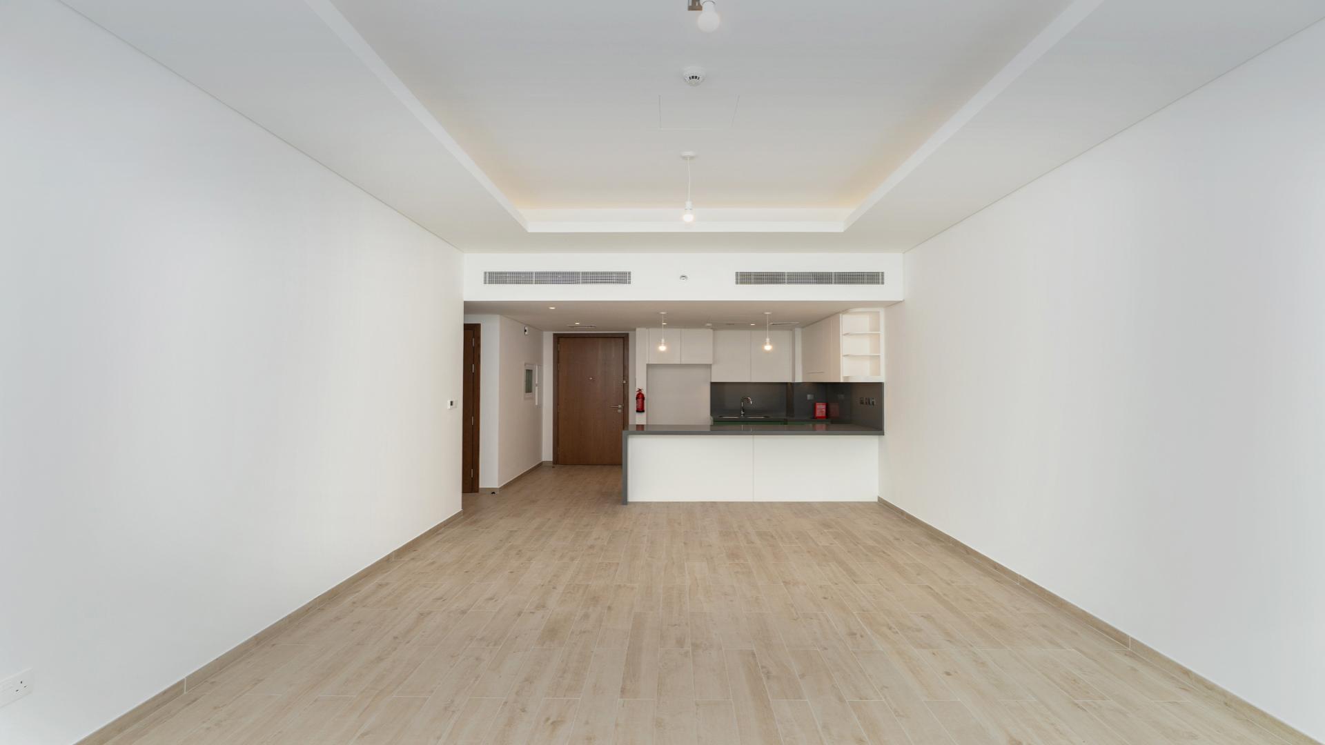 Modern kitchen and living area in 1-bedroom apartment, Central Park at City Walk